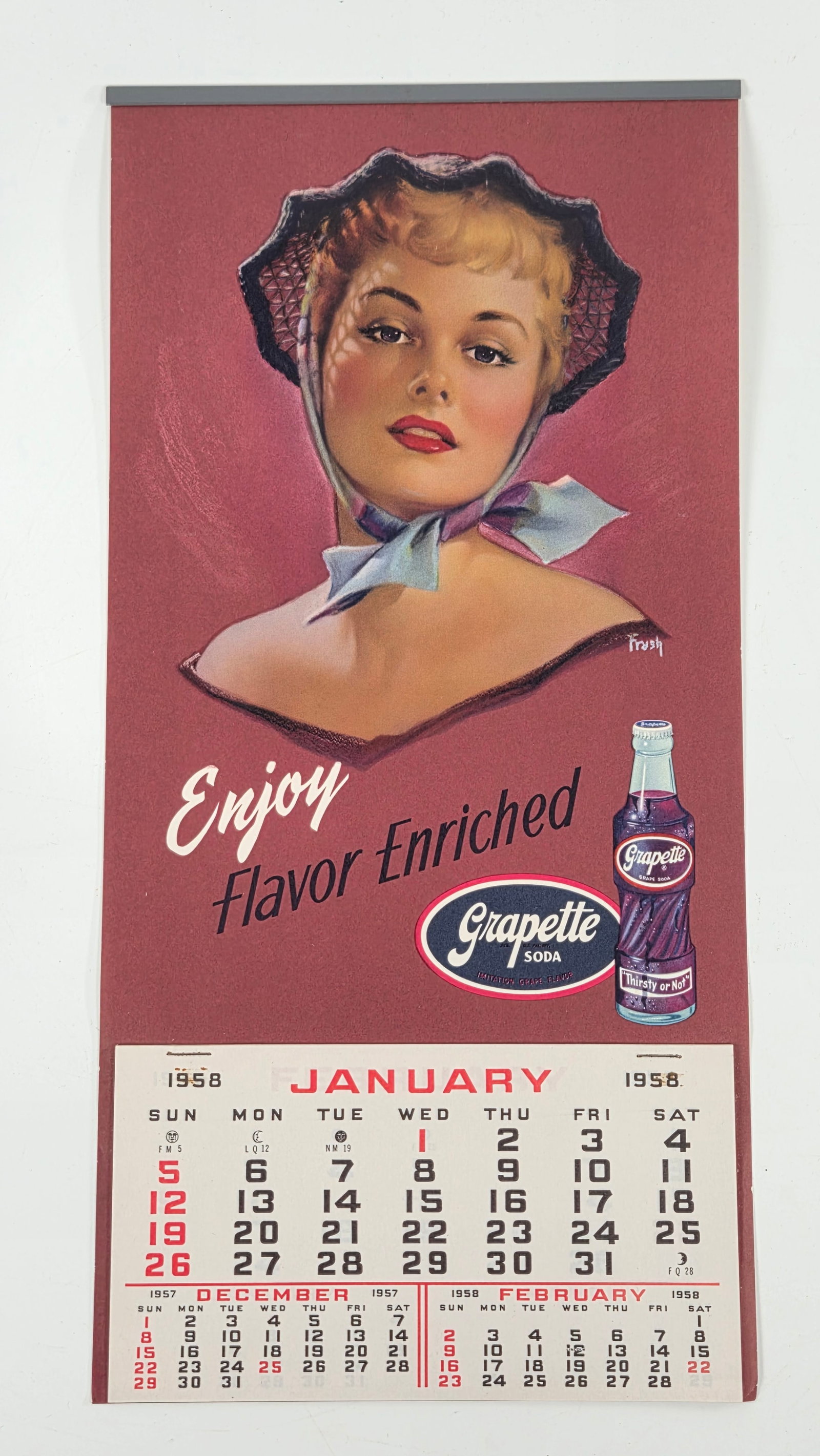 1958 GRAPETTE SODA PEARL FRUSH ADVERTISING CALENDAR: CALENDAR REMAINS IN VERY GOOD CONDITION - ALL MONTHS PRESENT - CLEAN BRIGHT FRUSH ILLUSTRATION