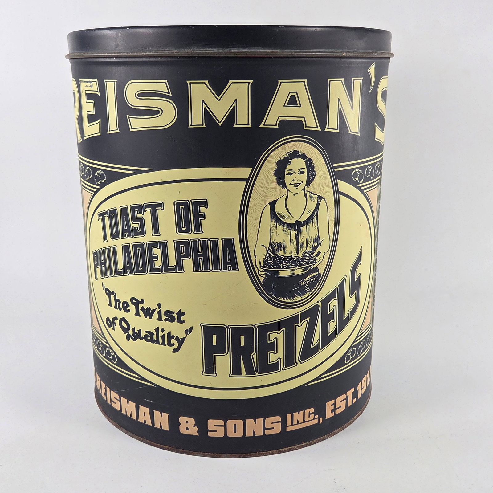 REISMAN & SONS TOAST OF PHILADELPHIA PRETZEL TIN: TIN REMAINS IN GOOD CONDITION WITH SOME LIGHT WEAR - MARKS ON UNDERSIDE