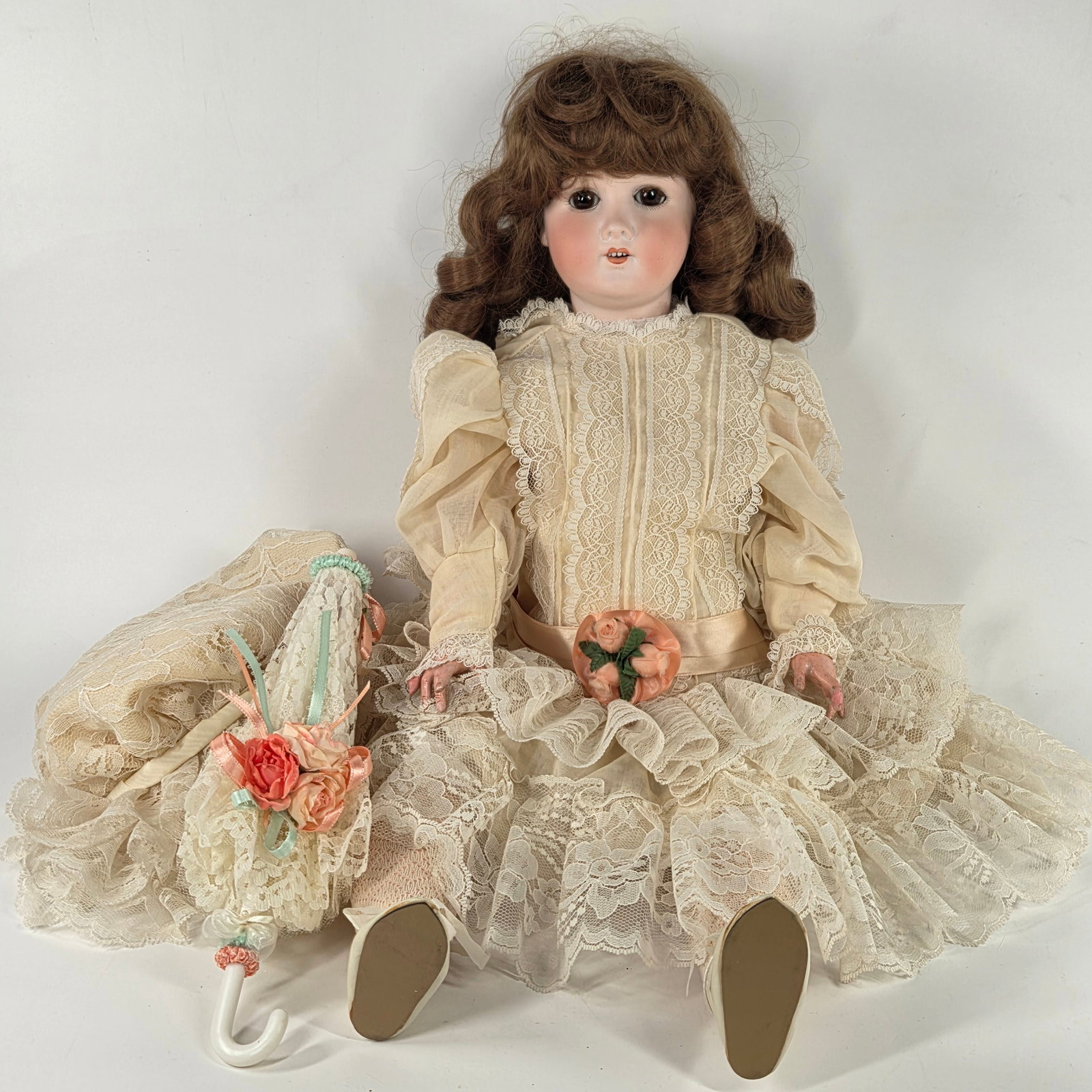 GERMAN BISQUE PORCELAIN DOLL WITH LACE DRESS & PARASOL: REMAINS IN GOOD CONDITION - LIGHT GENERAL WEAR - WORN HANDS