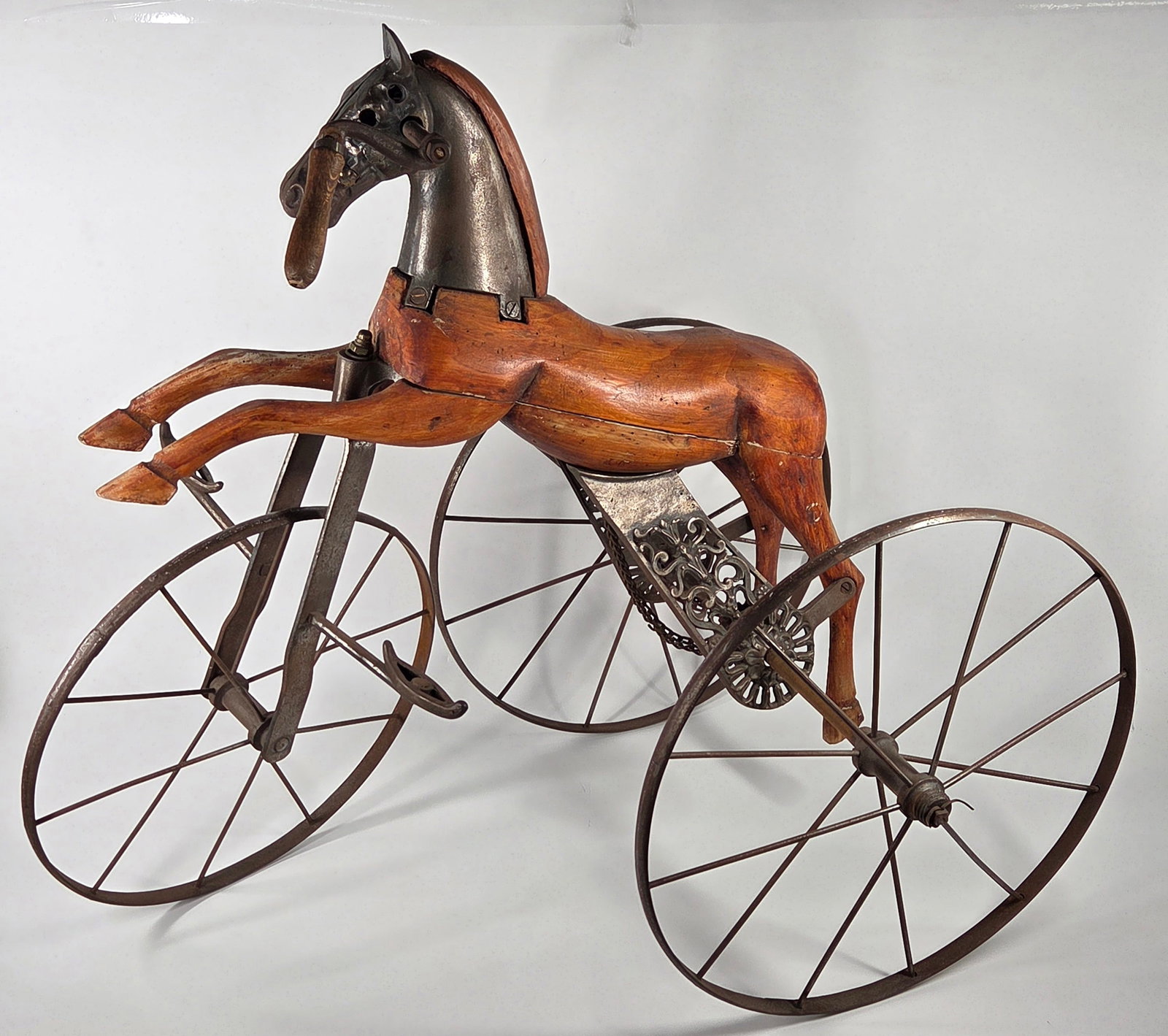FRENCH CARVED WOOD HORSE VELOCIPEDE TRICYCLE: EYE CATCHING CARVED WOOD CHILD'S TRICYCLE IN GOOD CONDITION - SOME GENERAL WEAR - MISSING SCREW AT BACK LEG