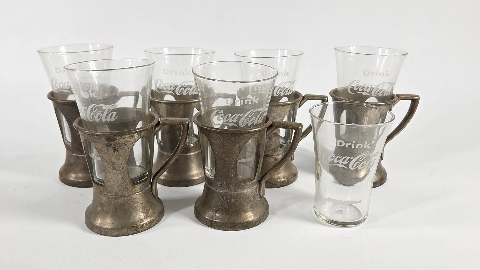 7) COCA COLA SODA FOUNTAIN GLASSES IN 6) SILVER LILY CUP HOLDERS: GROUP REMAINS IN GOOD CONDITION WITH SOME WEAR - 18% NICKEL SILVER
