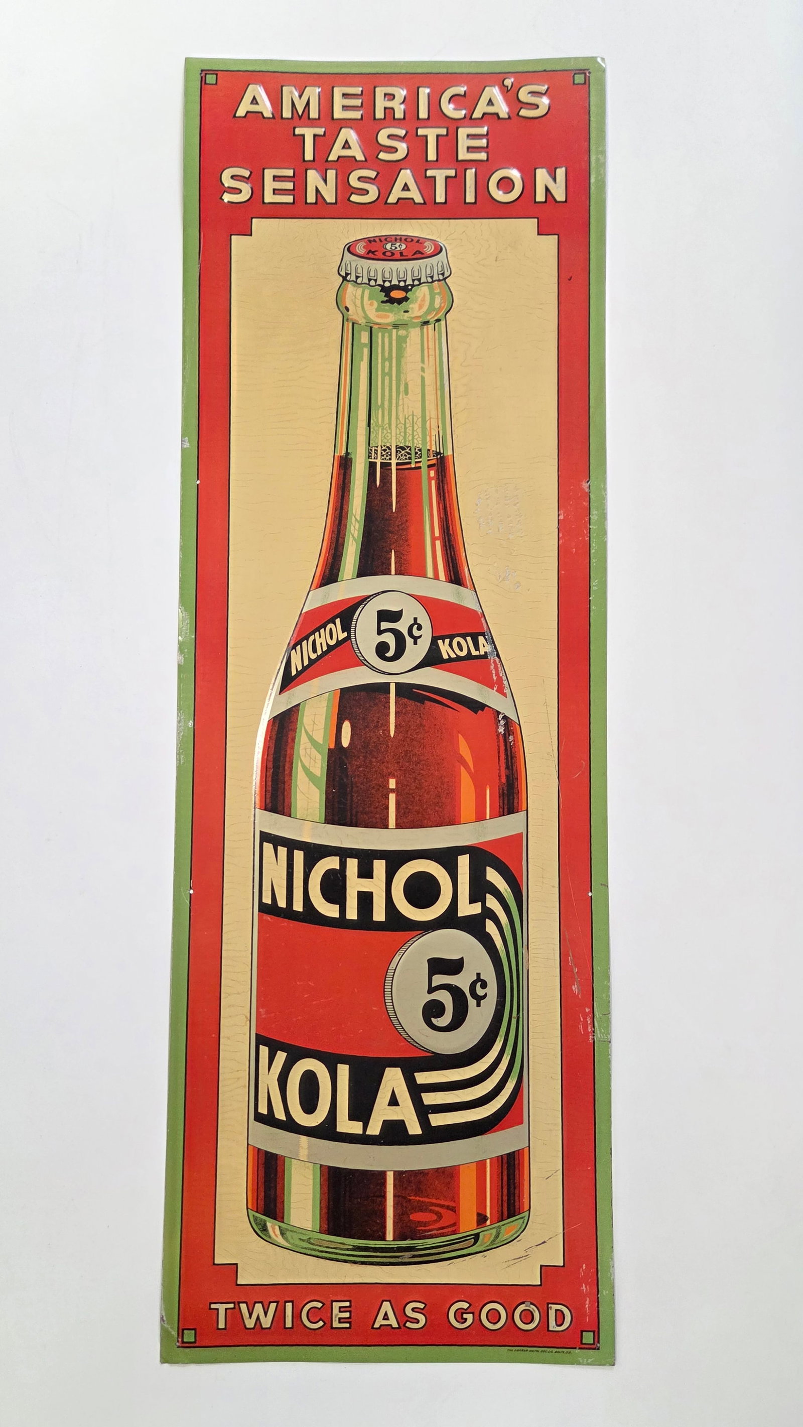 NICHOL KOLA EMBOSSED METAL ADVERTISING SIGN: REMAINS IN VERY GOOD CONDITION WITH SOME LIGHT MARKS