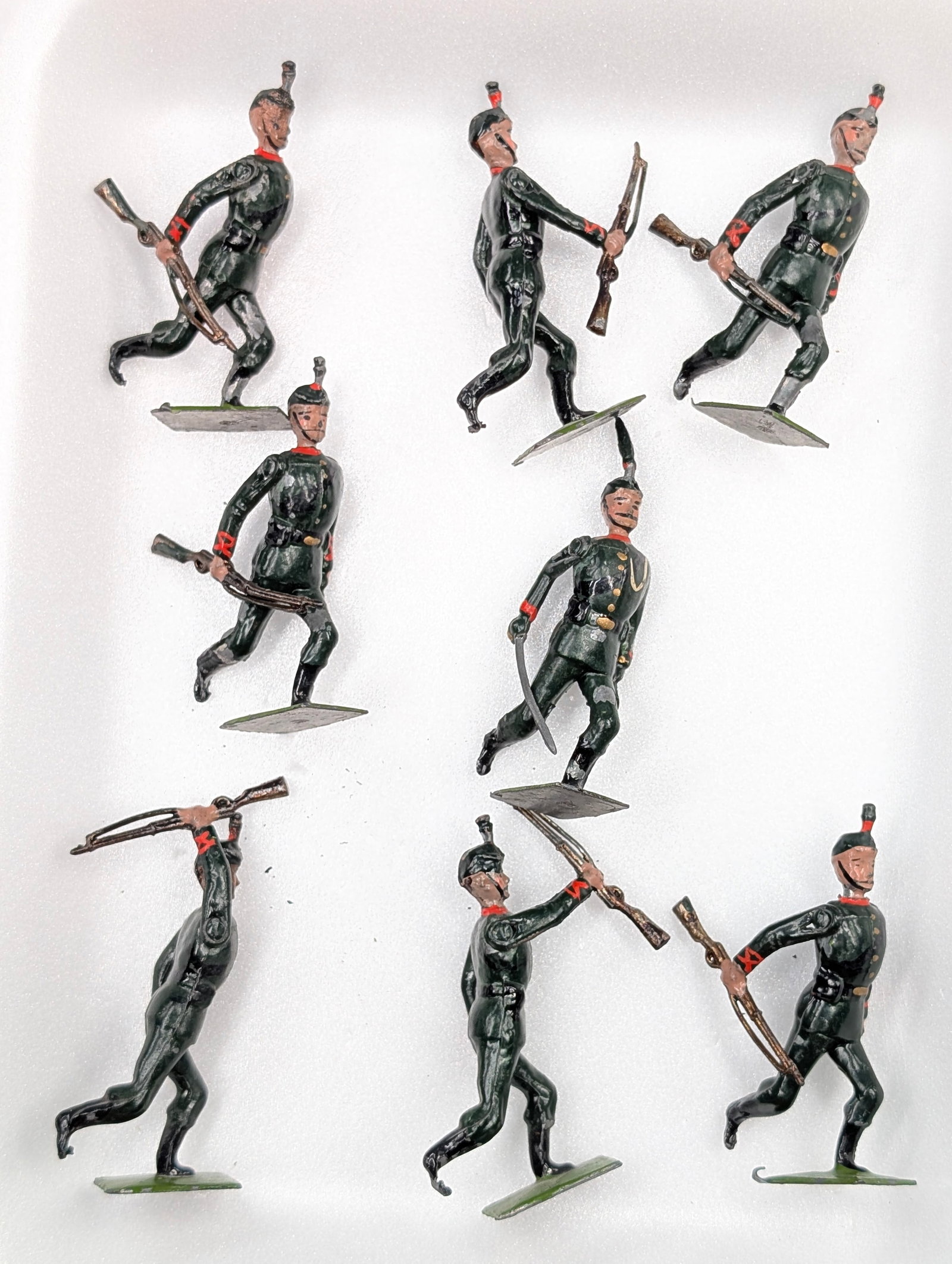 SET OF 8 VINTAGE HAND PAINTED SOLDIERS: ALL REMAIN IN FAIR TO GOOD CONDITION, SHOWING PAINT WEAR.