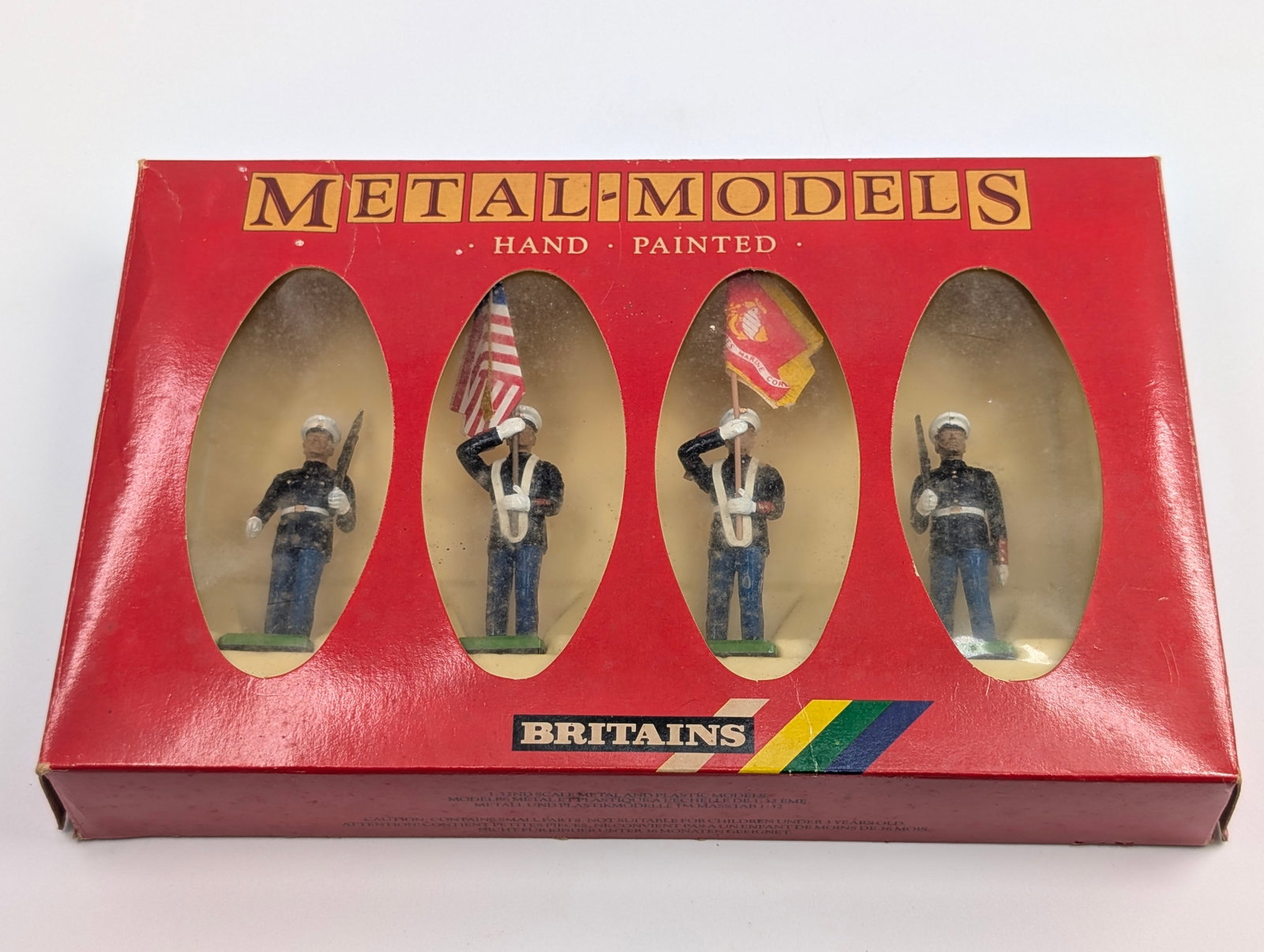BRITAINS USMC COLOUR PARTY: REMAINS IN GOOD CONDITION, BOX SHOWING WEAR.