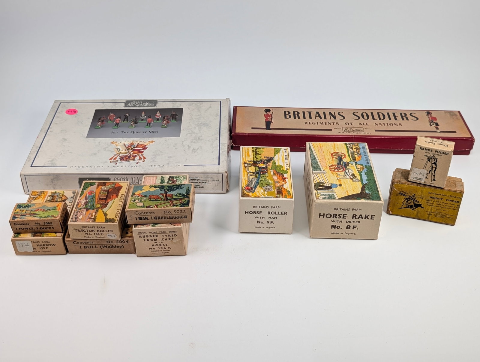 ASSORTMENT OF VINTAGE BRITAIN BOXES: MOST ALL REMAIN IN GOOD CONDITION, SHOWING SOME TYPICAL WEAR. TWO OLDER SOLDIER BOXES SHOWING SOME TEARS.