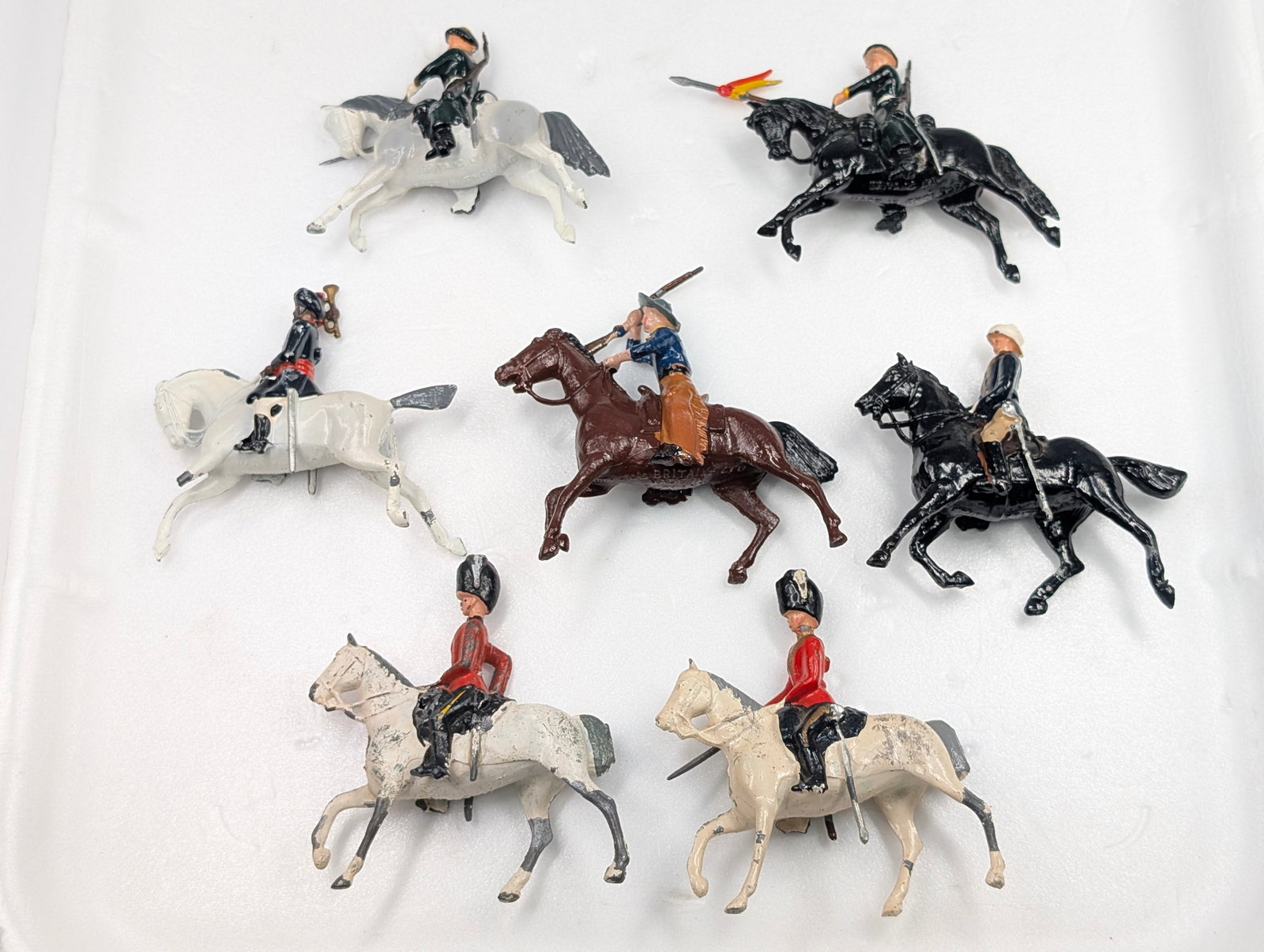 ASSORTED LOT OF HAND MOUNTED MOUNTED SOLDIERS: ALL REMAIN IN FAIR TO GOOD CONDITION, SHOWING SOME PAINT WEAR.
