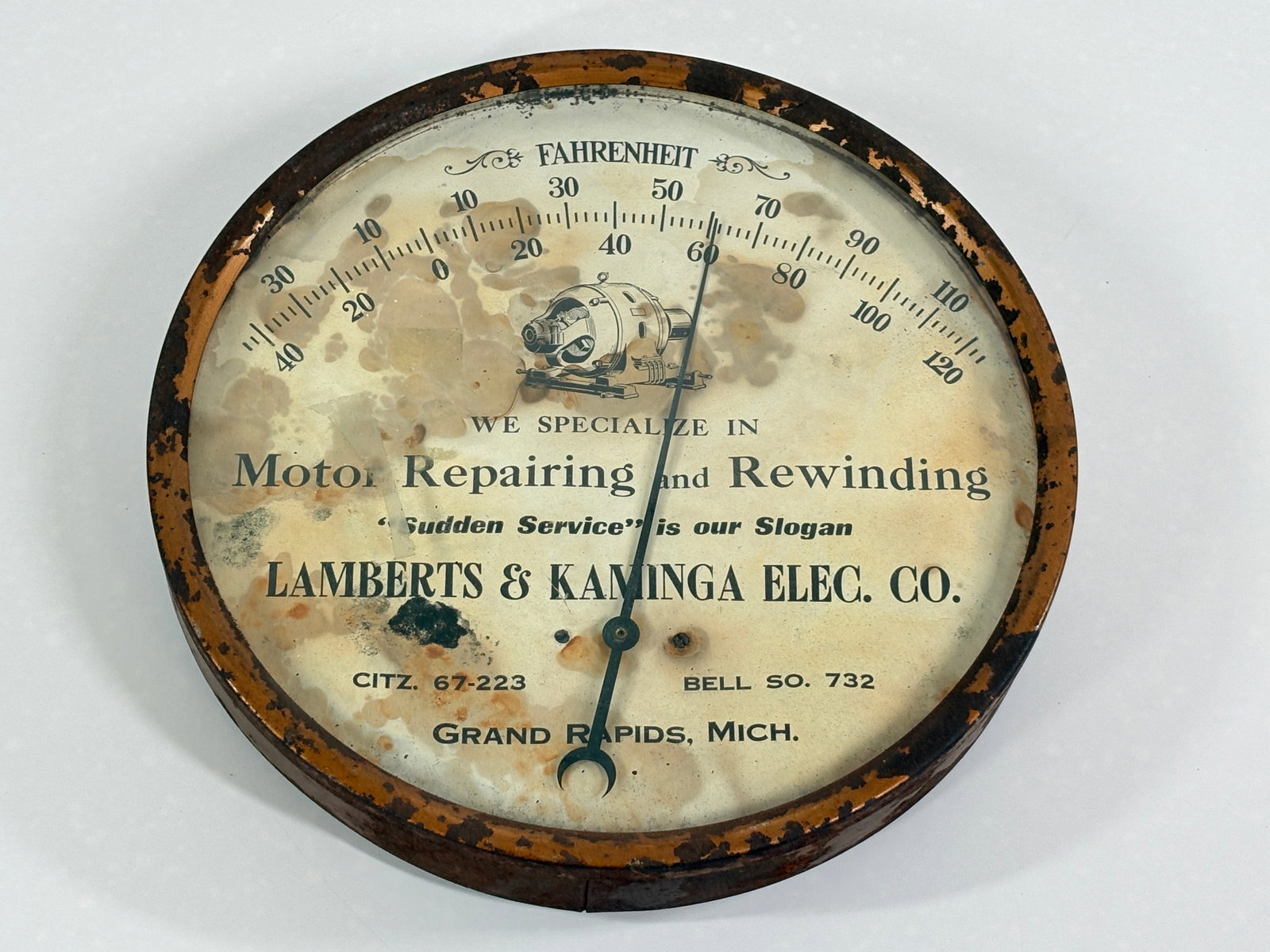 LAMBERTS & KAMINGA MOTOR REPAIRS ADVERTISING THERMOMETER: REMAINS IN FAIR CONDITION, SHOWING WEAR THROUGHOUT. DAMAGE TO BOTH FRAME AND LITHO.