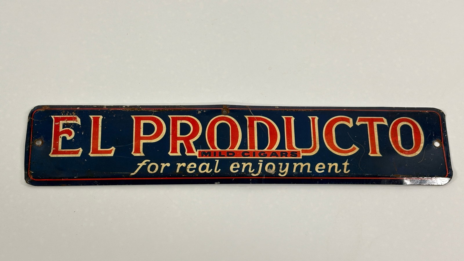 EL PRODUCTO MILD CIGARS ADVERTISING METAL SIGN: REMAINS IN GOOD CONDITION, SHOWING SOME SCRATCHES AND LIGHT BENDS.