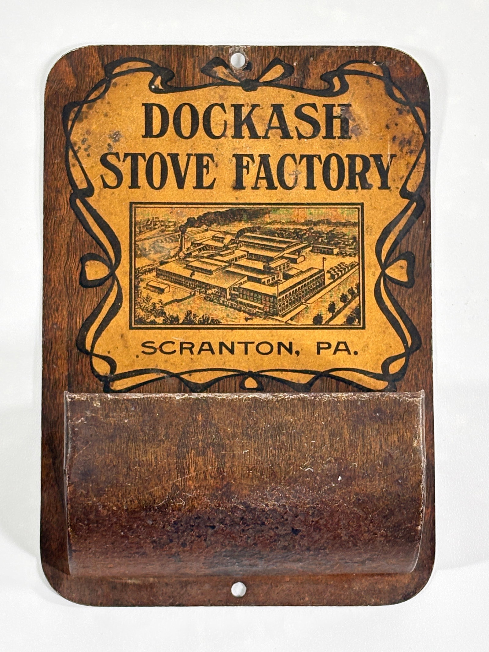 DOCKASH STOVE FACTORY ADVERTISING MATCH HOLDER: REMAINS IN FAIR TO GOOD CONDITION, SHOWING SOME TYPICAL WEAR.