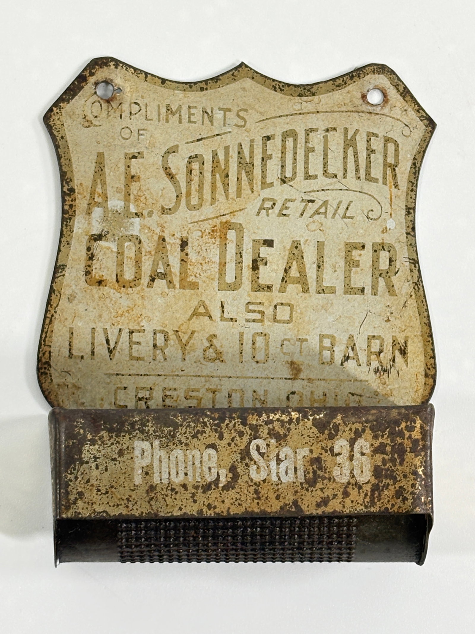A.E. SONNEDECKER COAL & LIVERY DEALER ADVERTISING MATCH HOLDER: REMAINS IN FAIR CONDITION, SHOWING WEAR THROUGHOUT.