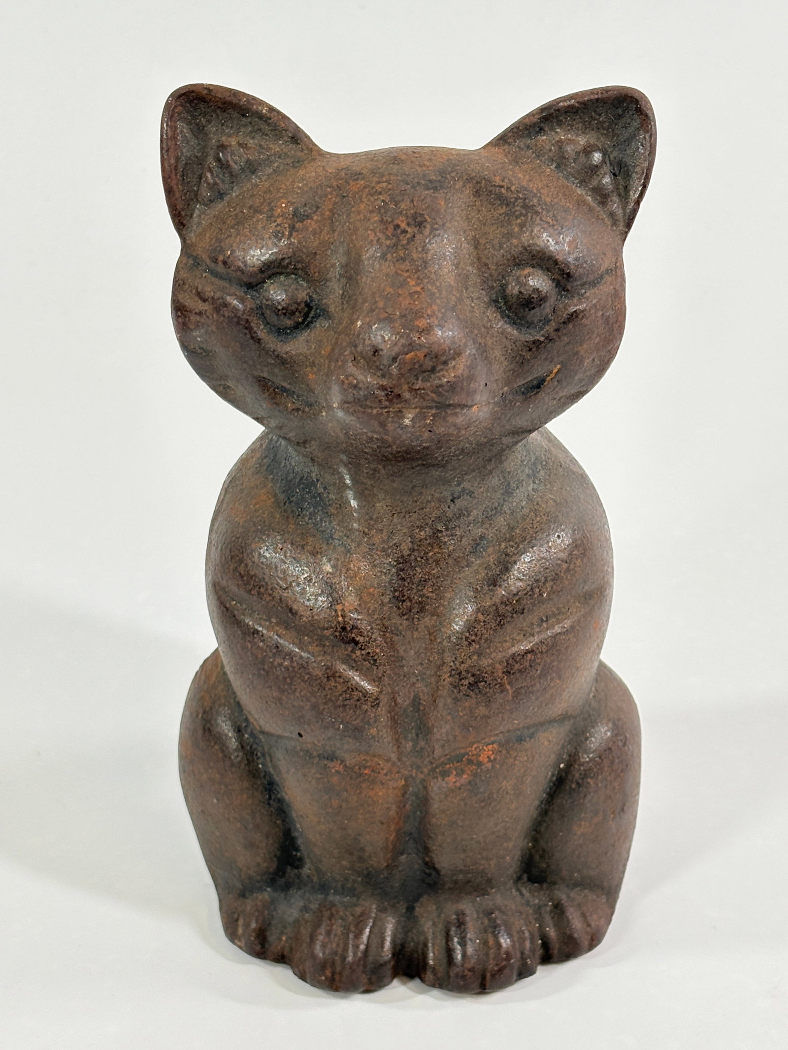 ANTIQUE HEAVY CAST IRON SITTING CAST DOORSTOP (1 of 5)