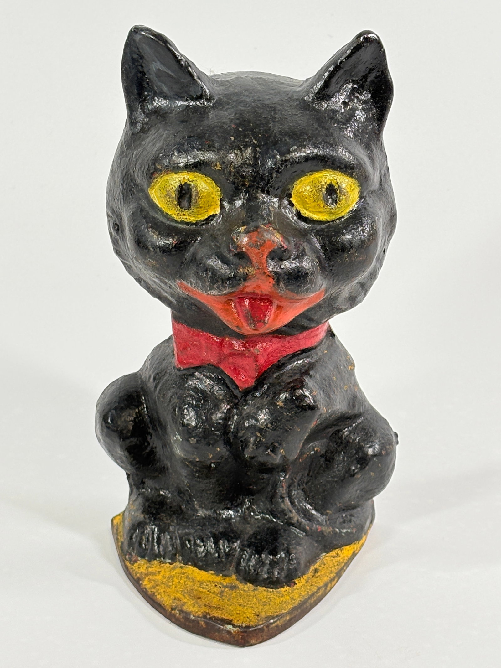 ANTIQUE CAST IRON COMICAL CAT DOORSTOP