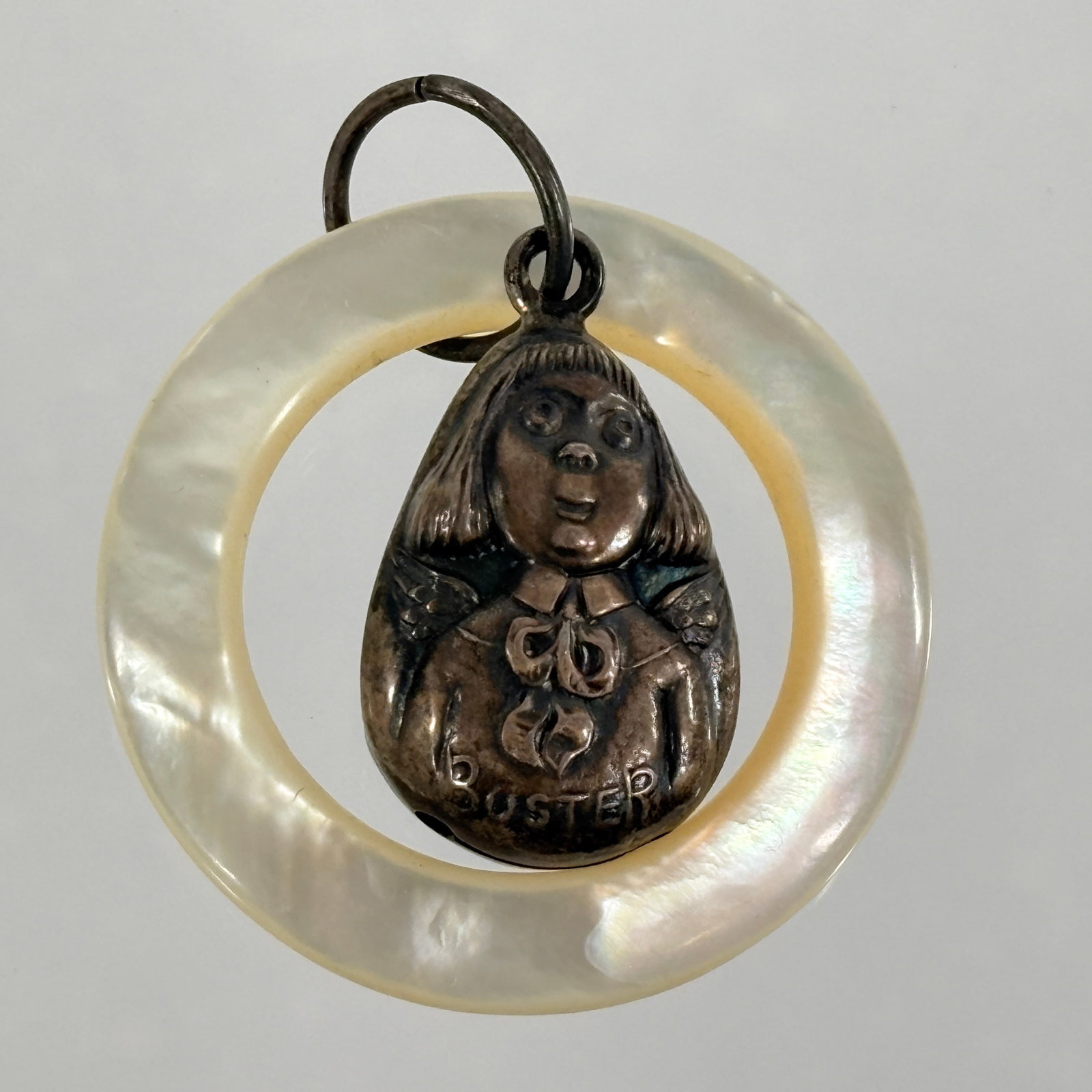 BUSTER BROWN & TIGE STERLING SILVER BABY RATTLE / TEETHING RING: REMAINS IN GOOD CONDITION, SHOWING SOME LIGHT TYPICAL WEAR. MOP RING.