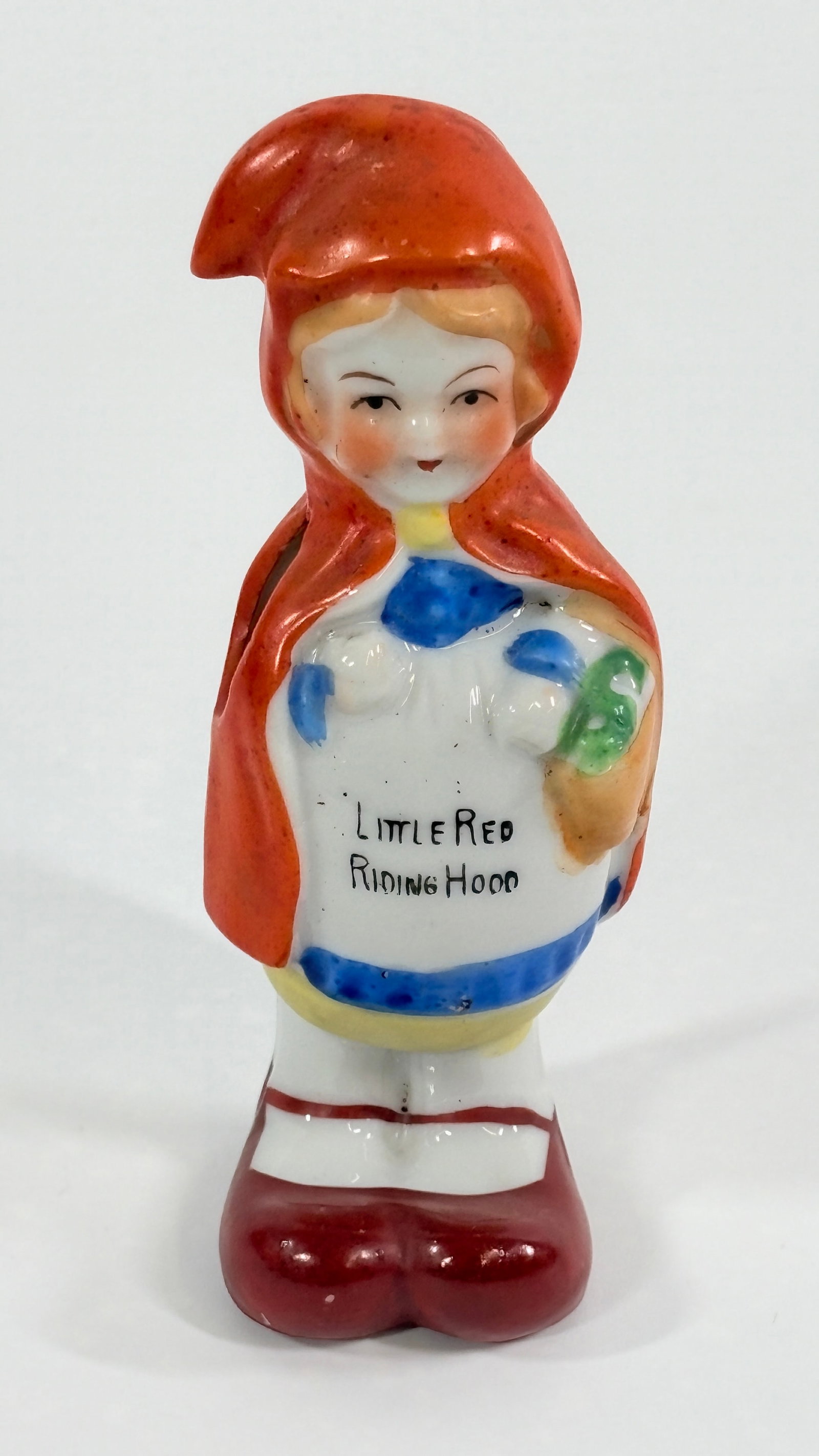 JAPAN PAINTED BISQUE LITTLE RED RIDING HOOD TOOTHBRUSH HOLDER: REMAINS IN GOOD CONDITION, NO CHIPS OR CRACKS.