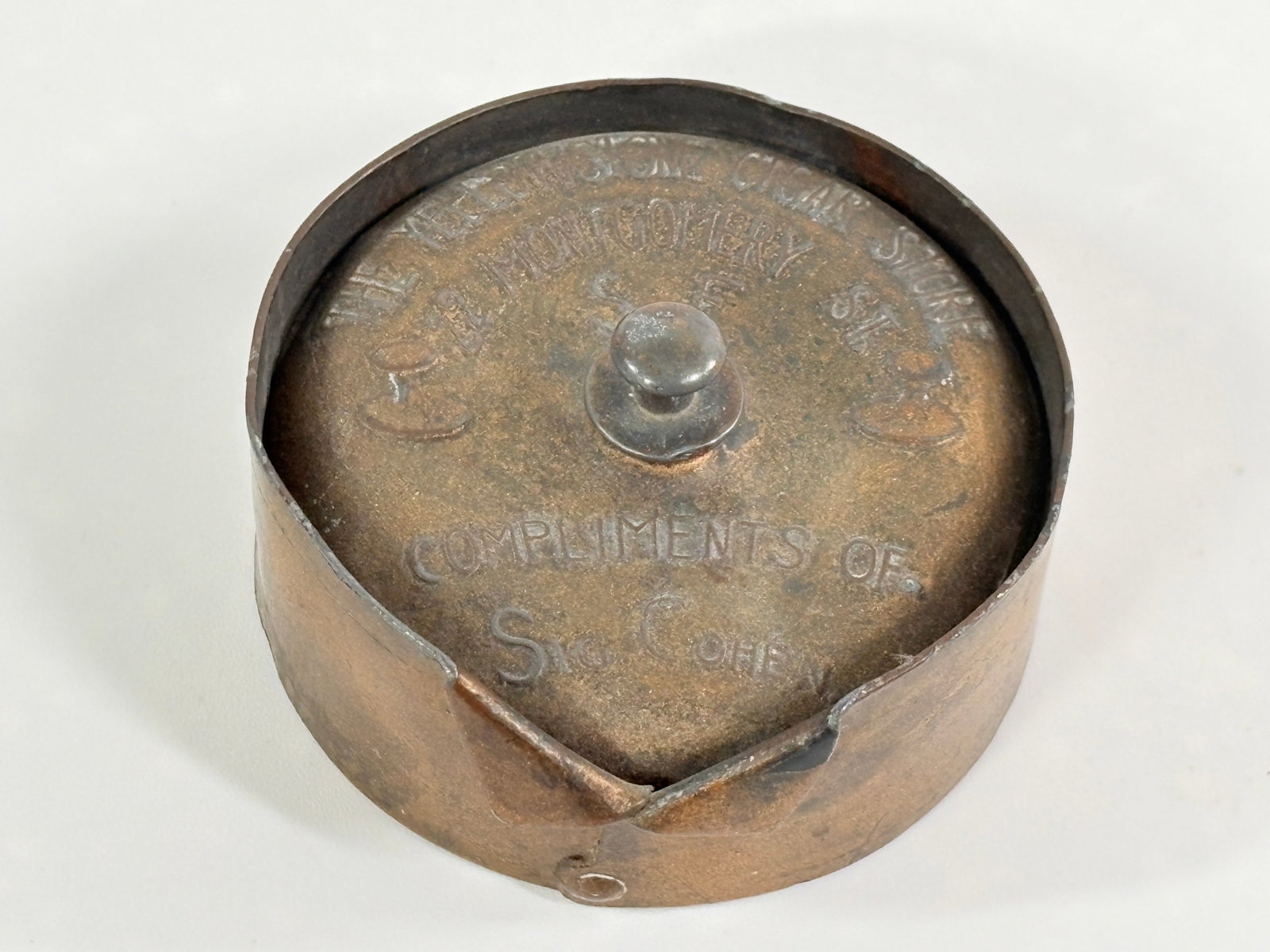 THE YELLOWSTONE CIGAR STORE COLLAR SHAPED BUTTON BOX: REMAINS IN FAIR TO GOOD CONDITION, SHOWING TYPICAL WEAR THROUGHOUT.