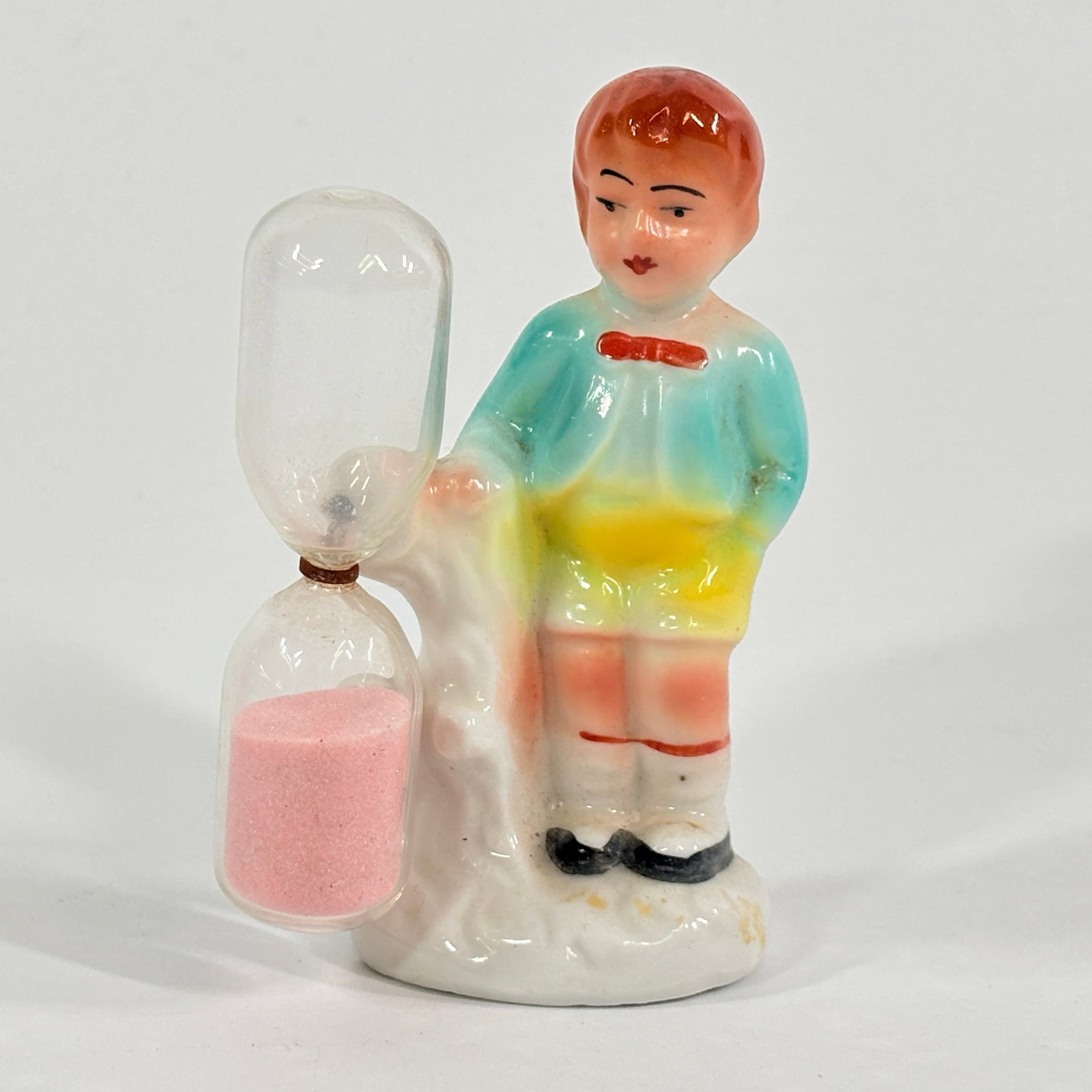 GERMAN PORCELAIN BOY KITCHEN TIMER: REMAINS IN GOOD CONDITION, SHOWING SOME TYPICAL WEAR.