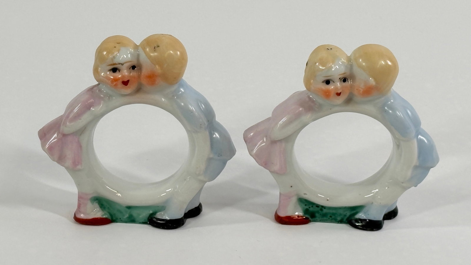 PAIR OF JAPAN BISQUE BOY & GIRL NAPKIN RINGS: BOTH REMAIN IN GOOD CONDITION, NO CHIPS OR CRACKS.