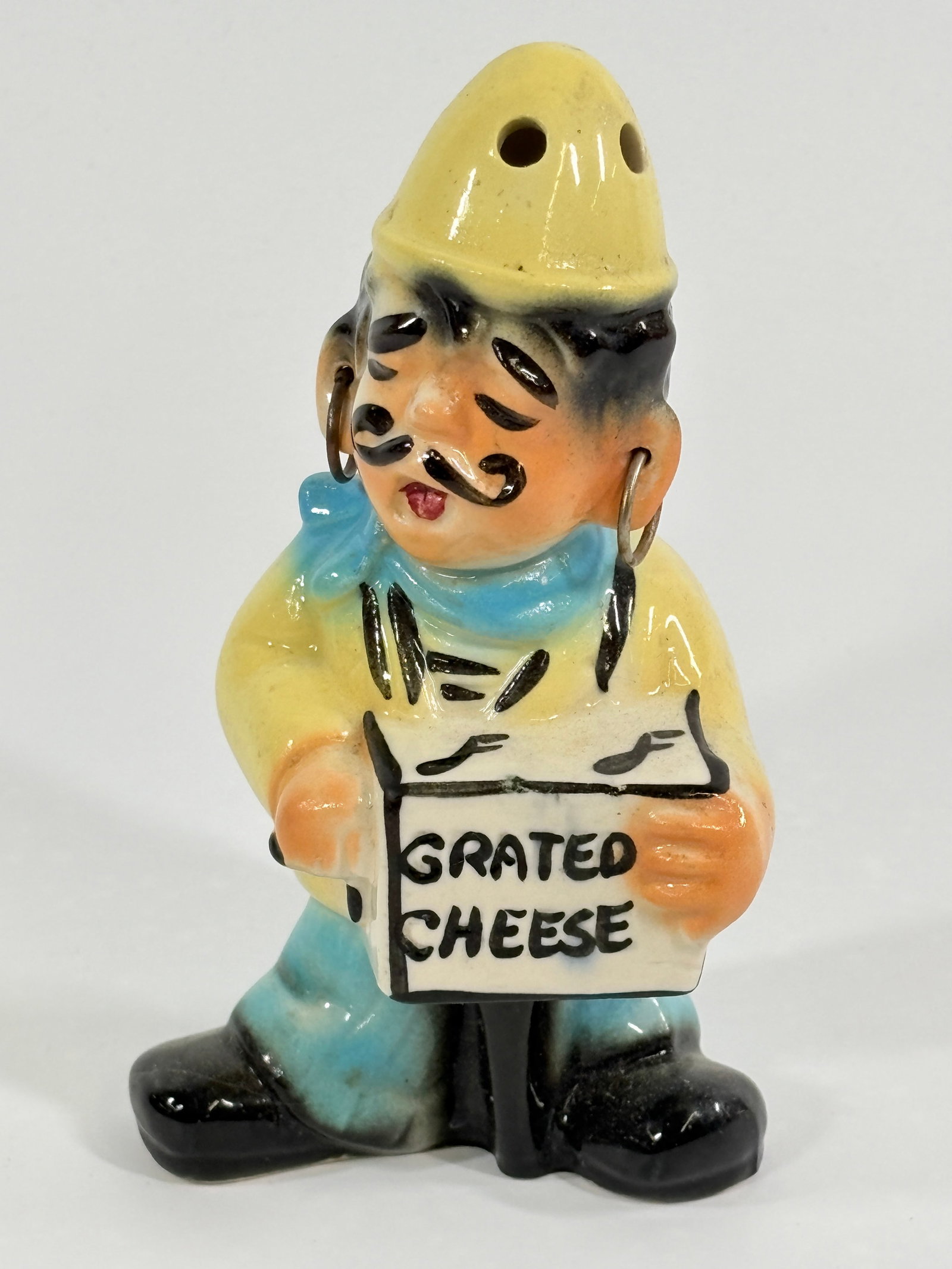 VINTAGE CERAMIC GRATED CHEESE ORGAN GRINDER SHAKER: REMAINS IN GOOD CONDITION, NO CHIPS OR CRACKS.