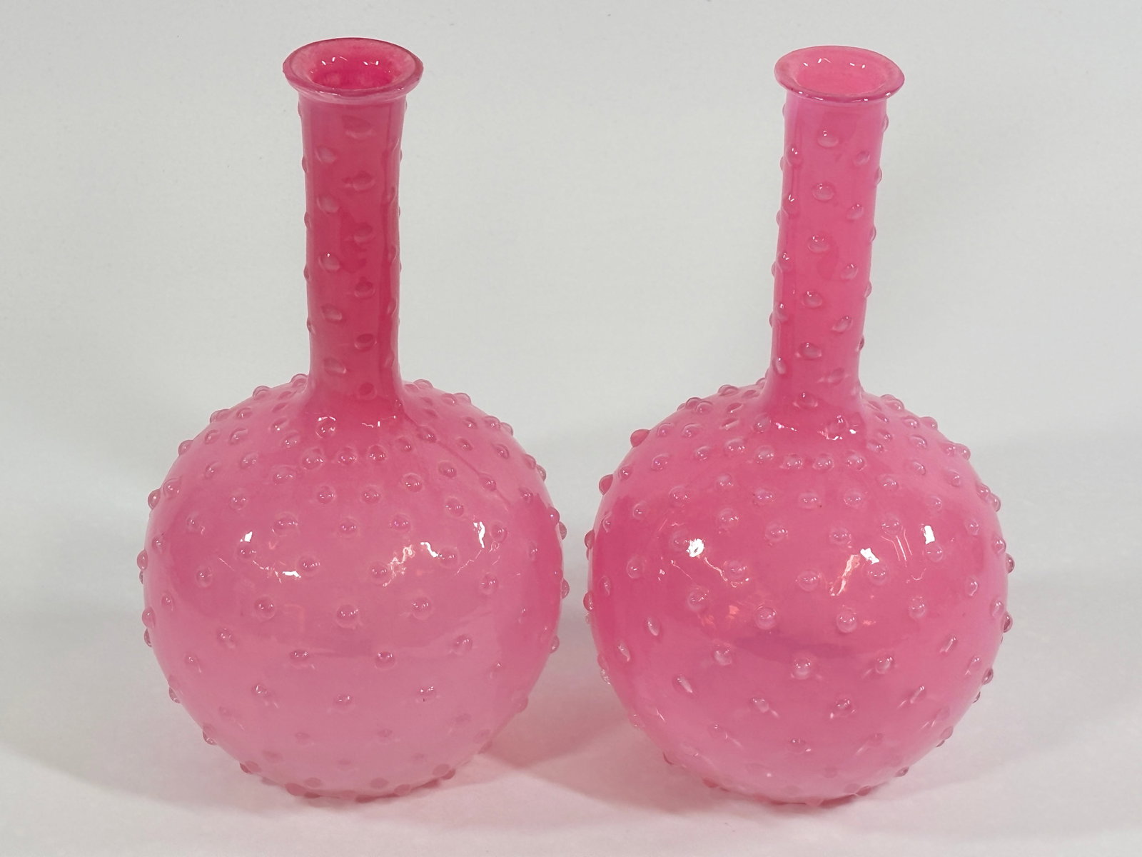 PAIR OF VICTORIAN PINK HOBNAIL BARBER TONIC BOTTLES: BOTH REMAIN IN VERY GOOD CONDITION, NO CHIPS OR CRACKS.