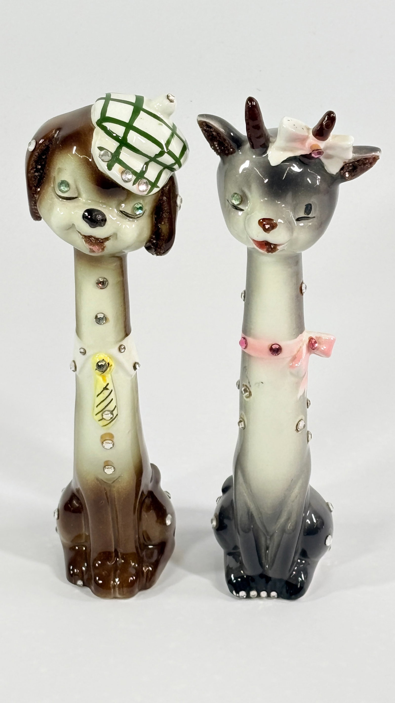 VINTAGE DOG & DEER CERAMIC LONG NECK JEWELED SALT & PEPPER SET: SET REMAINS IN VERY GOOD CONDITION WITH ORIGINAL STICKER. NO CHIPS OR CRACKS.