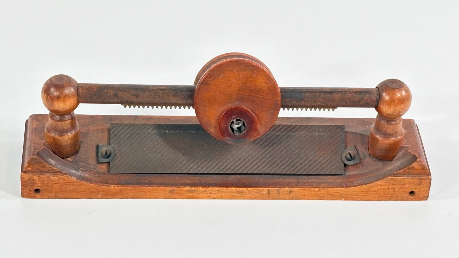 ANTIQUE WOOD HAND PUSH PENCIL POINTER SHARPENER: REMAINS IN GOOD CONDITION, SHOWING SOME TYPICAL WEAR. INCLUDES PART OF ORIGINAL LABEL ON BOTTOM.