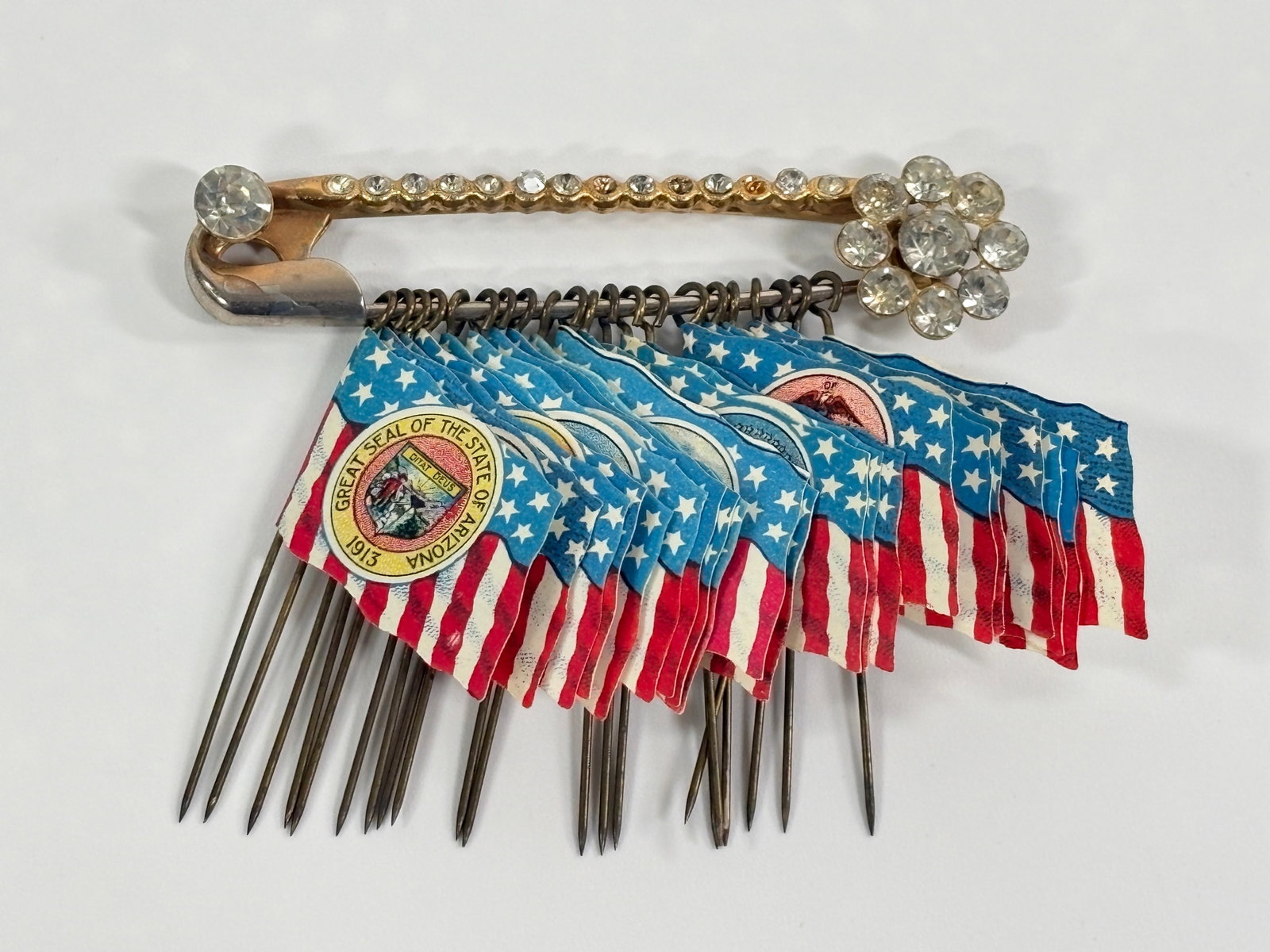 ANTIQUE CELLULOID US FLAG PINS: ALL REMAIN IN GOOD CONDITION, SHOWING SOME TYPICAL WEAR.