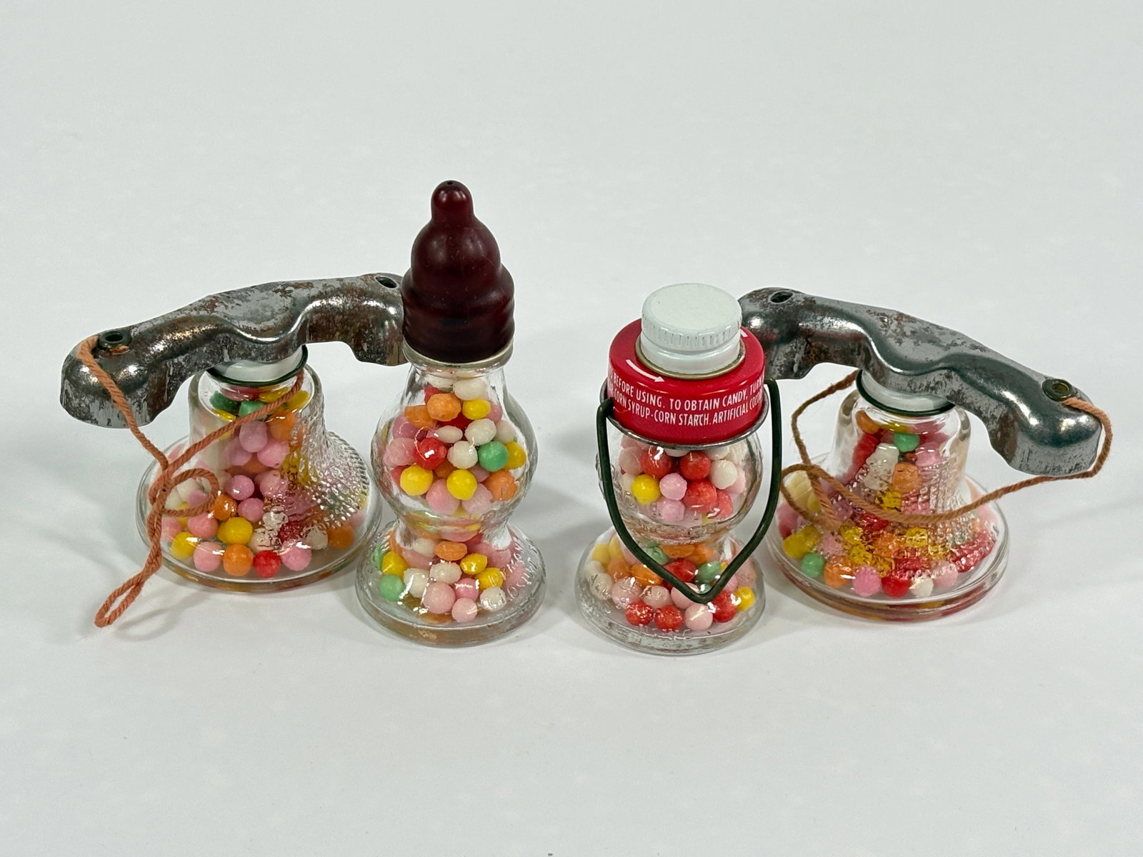 4) ANTIQUE GLASS CANDY CONTAINERS: ALL REMAIN IN GOOD CONDITION.