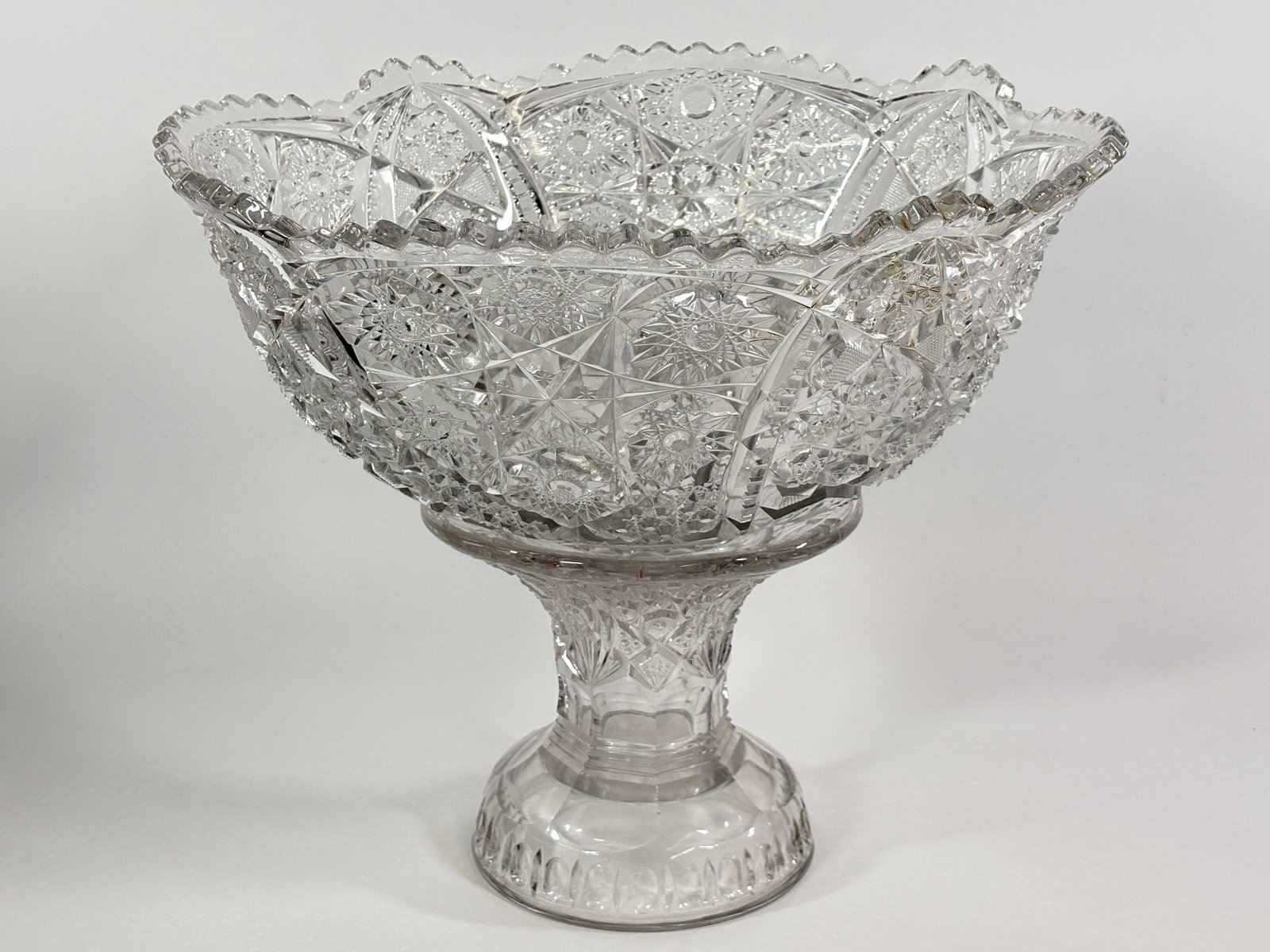 ANTIQUE CUT GLASS PUNCH BOWL & CUPS: REMAINS IN GOOD CONDITION, SHOWING SOME TYPICAL USAGE WEAR. NO CHIPS OR CRACKS.