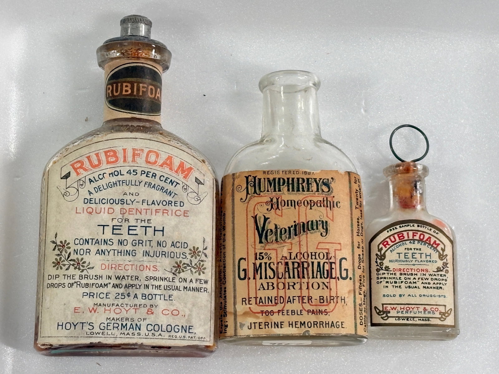 2) ANTIQUE RUBIFOAM TEETH BOTTLES & VETERINARY MISCARRIAGE BOTTLE: ALL REMAIN IN FAIR TO GOOD CONDITION, SHOWING SOME TYPICAL WEAR TO PAPER LABELS.