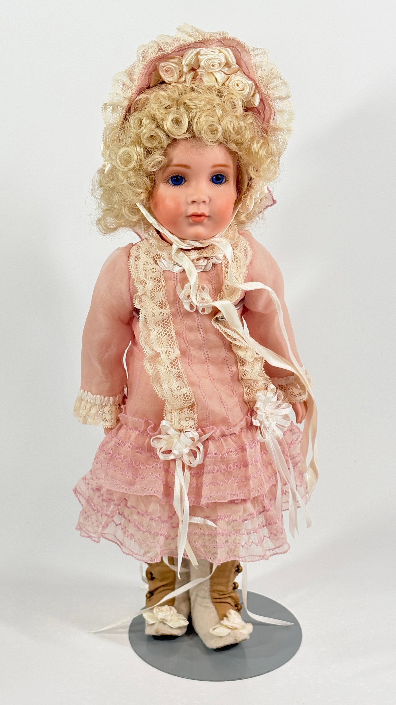 CONTEMPORARY ROCKWELL BISQUE DOLL BABY: REMAINS IN GOOD CONDITION, SHOWING SOME LIGHT WEAR.