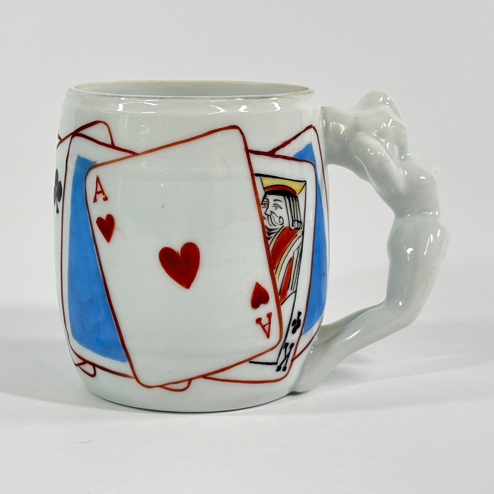 ARITA CERAMIC PLAYING CARDS POKER NUDE HANDLE MUG: REMAINS IN GOOD CONDITION, SHOWING SOME TYPICAL WEAR. NO CHIPS OR CRACKS.