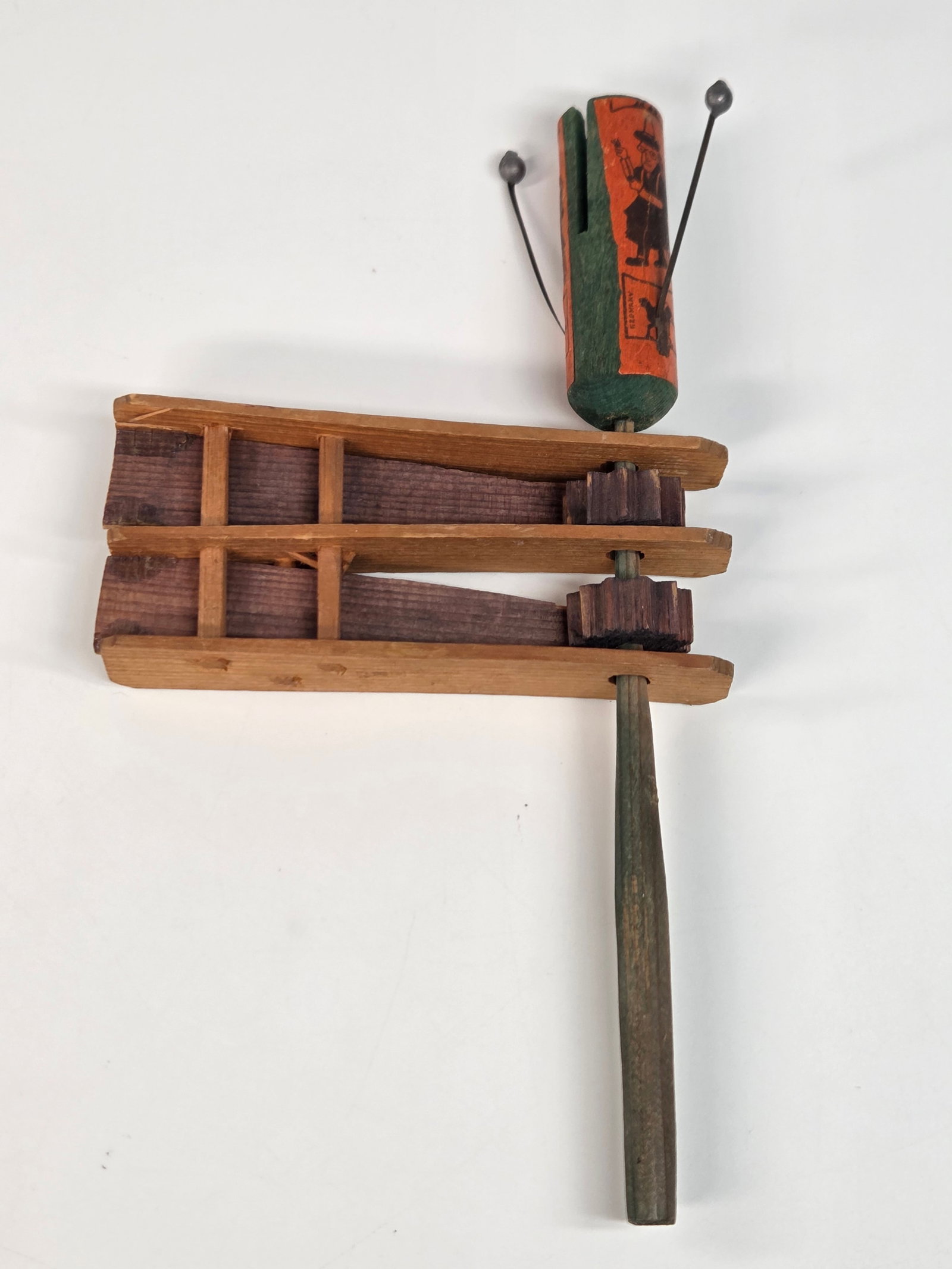 ANTIQUE GERMAN HALLOWEEN WOOD NOISEMAKER: REMAINS IN GOOD CONDITION, SHOWING SOME LIGHT TYPICAL USAGE WEAR.