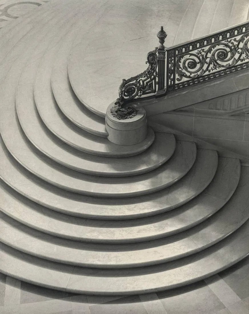 Paul Caponigro - Spiral Staircase, San Francisco, 1953: Paul Caponigro - Spiral Staircase, San Francisco, 1953. Photolitho. Measures: 7 x 8 3/4 inches.