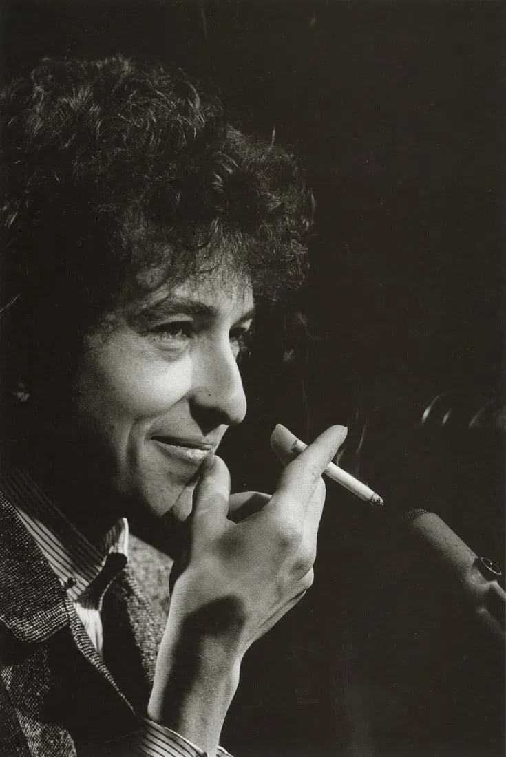 Jim Marshall - Bob Dylan Smiling, 1965: Jim Marshall - Bob Dylan Smiling, 1965. Photolitho. Measures: 4 3/4 x 7 1/4 inches.