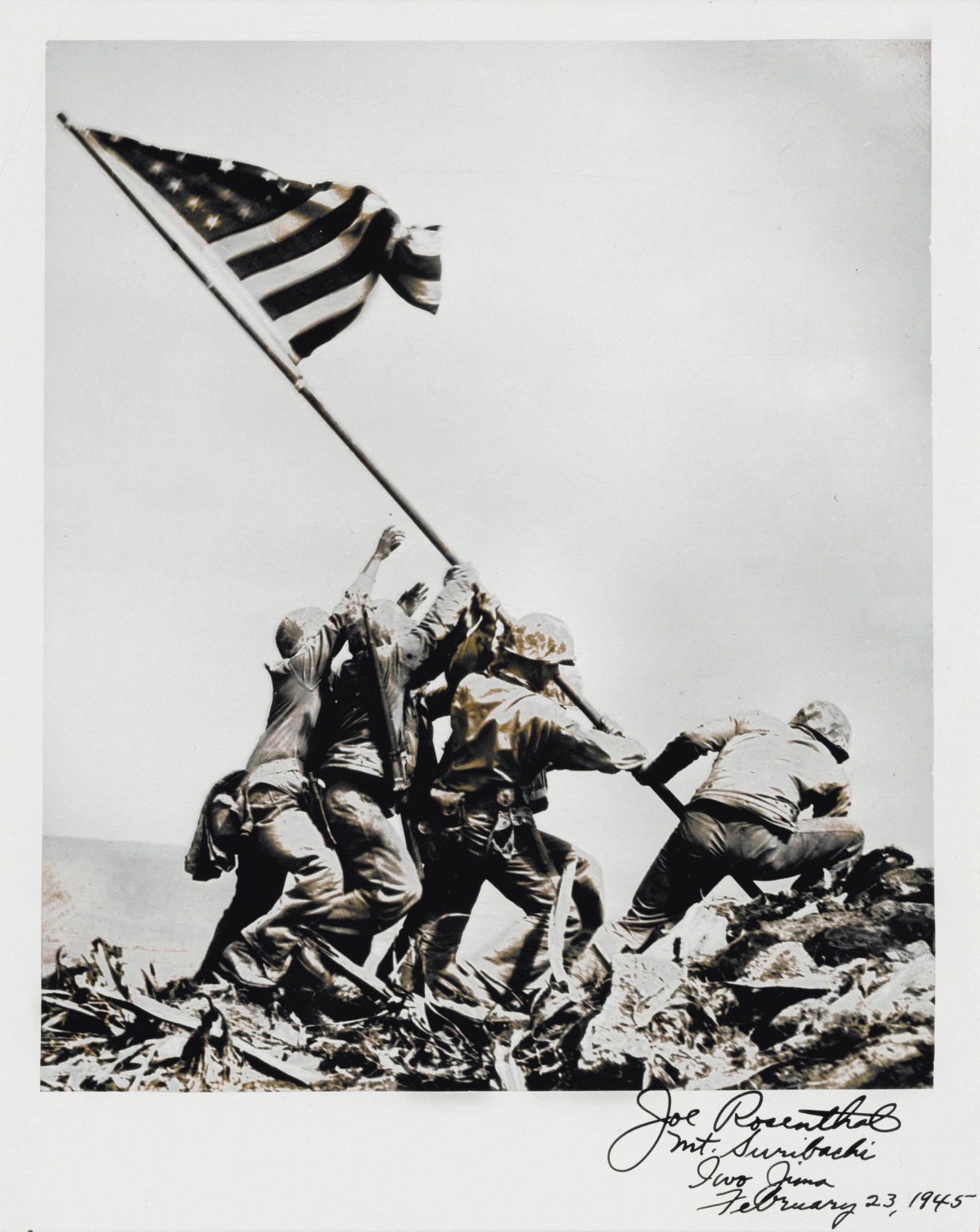 JOSEPH ROSENTHAL, Photographic print of Raising the Flag on Iwo Jima: [WORLD WAR II.] ROSENTHAL, Joseph. Photographic print of Raising the Flag on Iwo Jima, plate inscribed and signed: "Joe Rosenthal Mt. Suribachi Iwo Jima February 23, 1945." Printed later, measures 8 x