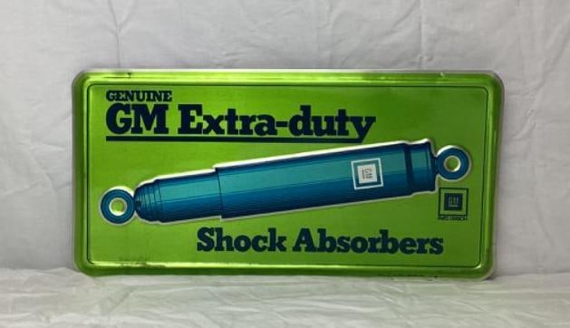 General Motors Shock Absorber Embossed Metal Sign (1 of 2)