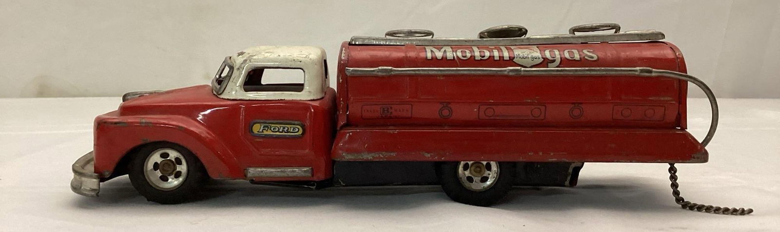 1950's Mobilgs Ford Japanese Tin Litho Friction Toy Tank Truck: 1950's Mobilgs Ford Japanese Tin Litho Friction Toy Tank Truck. Measures 9 x 2.5 x 3