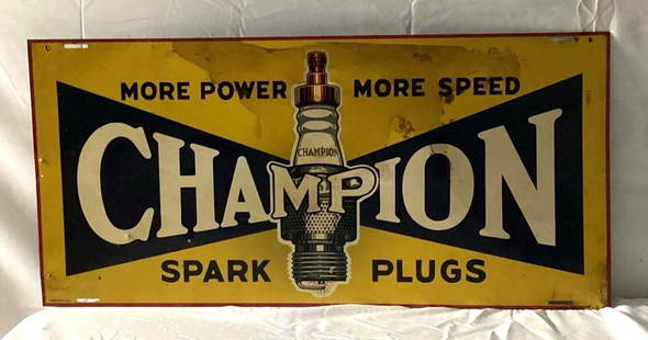 1930's Champion Spark Plugs Sign: Champion Spark Plugs "More Power More Speed" single sided sign. 1930's five color sign presents with fair color and wear. Measures 26x12.