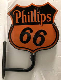 Phillips 66 double sided die-cut shield shaped porcelain sign.  Features custom made flanged: Phillips 66 double sided die-cut shield shaped porcelain sign. Features custom made flanged mounting bracket. Presents with nice color and a few chips. Measures 30".