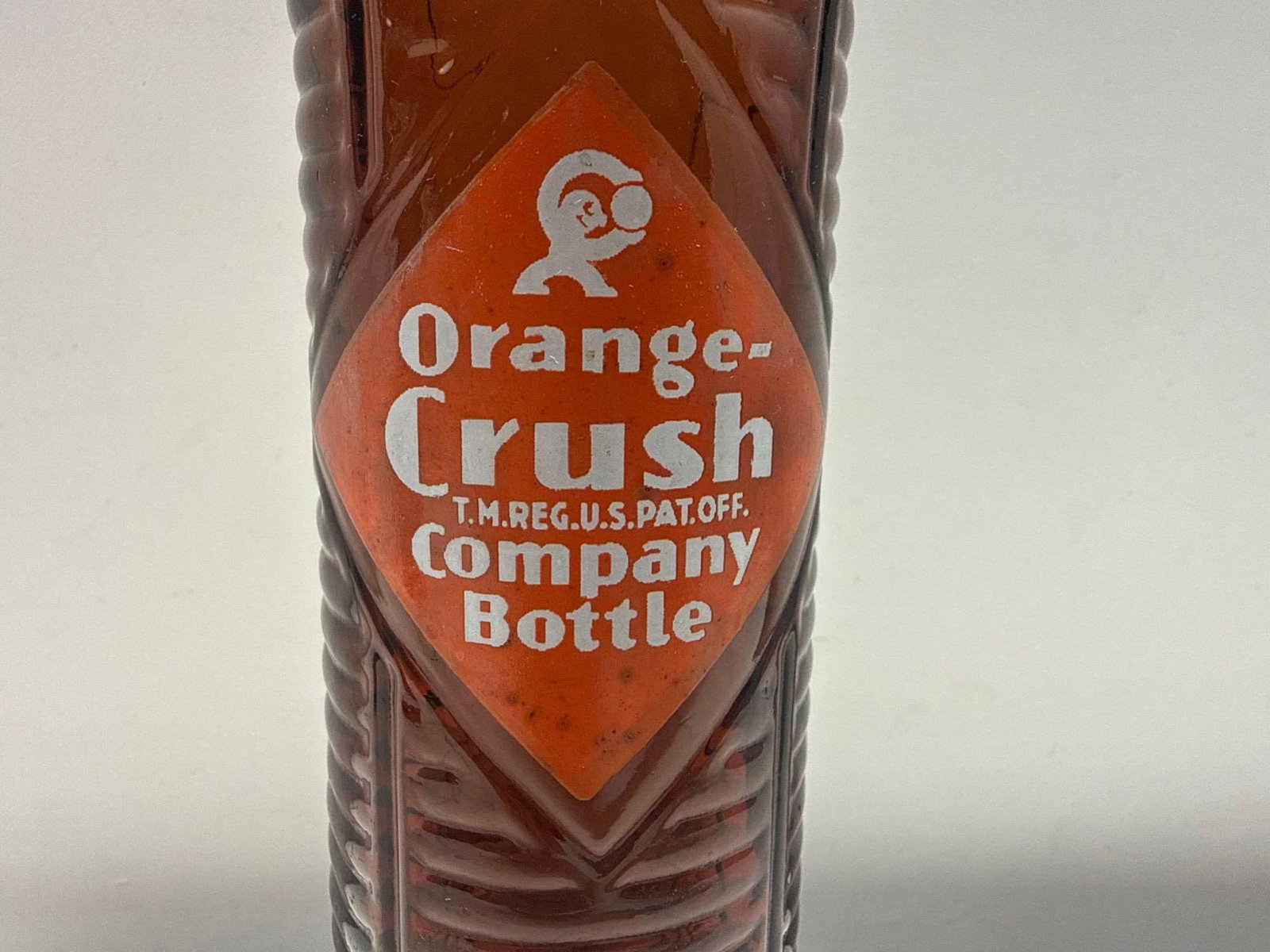 Two Amber Orange Crush Bottles w/ Crushy Man - 2