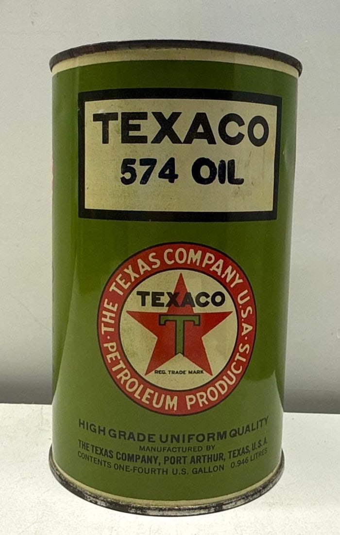1920's Texaco 574 Oil Quart Oil Can: Texaco 574 Motor Oil quart can. Soldered seam round can dates to the 1920's and features the early Texaco "Port Arthur" logo. Presents with excellent color and light wear.