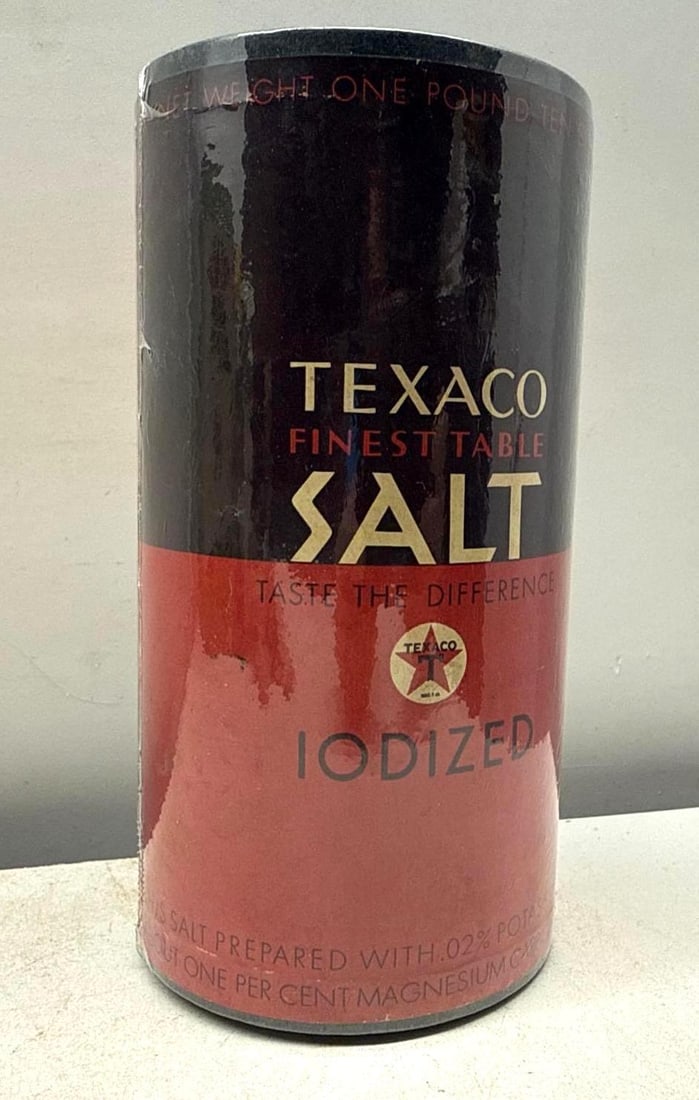 Texaco Finest Table Salt Shaker: Texaco Finest Iodized Table Salt. New old stock salt shaker is made of heavy cardboard and features a checkerboard design with Texaco branding. Presents in excellent condition.