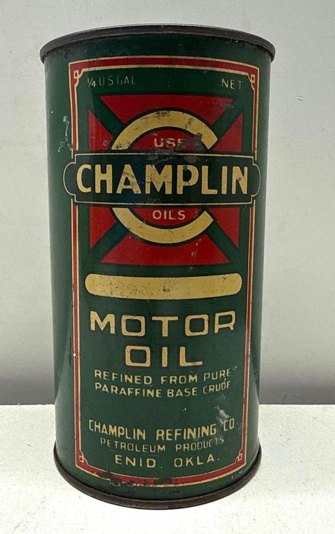 1920's Champlin Motor Oil Quart Oil Can Enid, Oklahoma: Champlin Oil round quart can with a flat top from Enid, Oklahoma.? Features unique green and red color scheme.? Soldered seam can dates to the 1920's and presents with nice color and light wear.