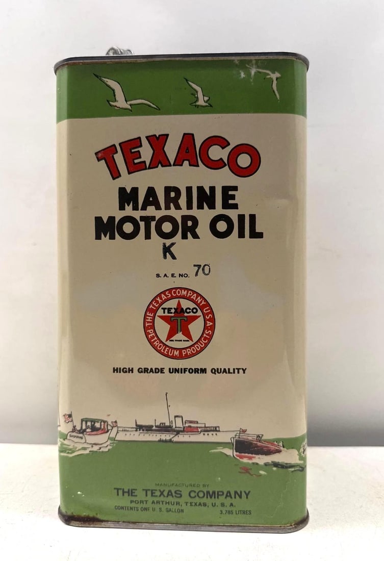 Texaco Marine Motor Oil One Gallon Oil Can: Texaco Marine Motor Oil one gallon vertical square oil can.? Features transport ships, sea gulls and boating scenes on all four sides of the can.? Presents with strong color and minor wear on display 