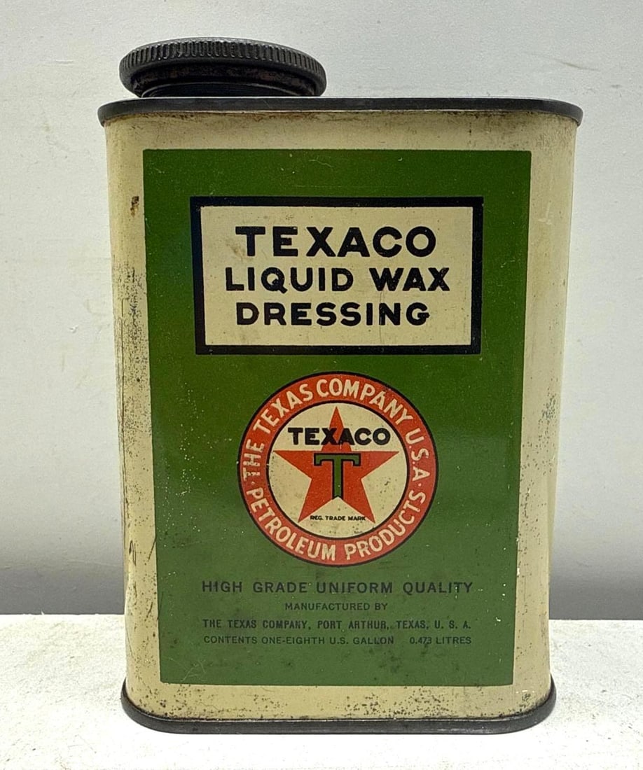 Texaco 1/8 Gallon Liquid Wax Dressing Can: Texaco Liquid Wax Dressing Can. Measures 1/8 gallon and is complete with original branded cap. Features early Texaco branding and product identification on front and reverse. Presents with strong colo