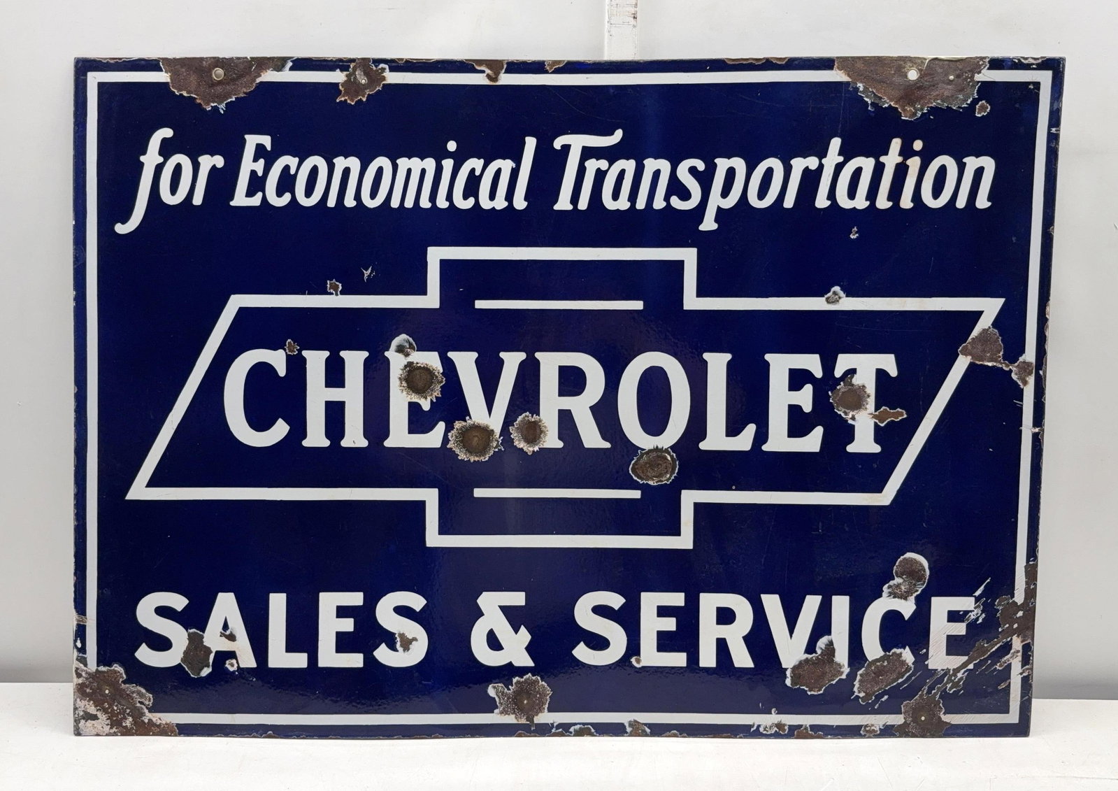 1920's Chevrolet "For Economical Transportation" Sales & Service Porcelain Sign: Chevrolet "For Economical Transportation" Sales & Service double sided porcelain sign.? This dealership sign dates to the 1920's.? Display side displays with good color and some chips the reverse has 