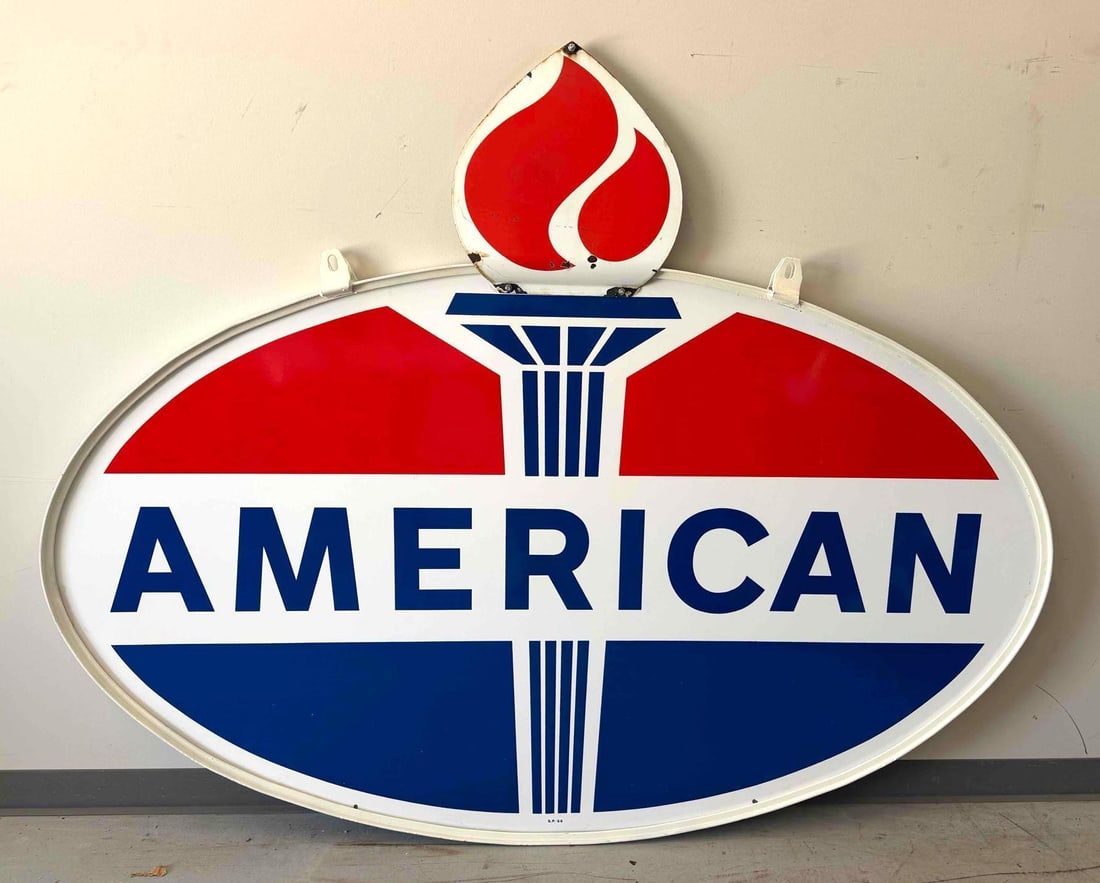 American Gasoline Porcelain Sign w/ Flame: American Gasoline double sided porcelain sign. This example is complete with flame attachment on each side and original hanging ring. Dated 1966 and presents with strong color and light wear.
