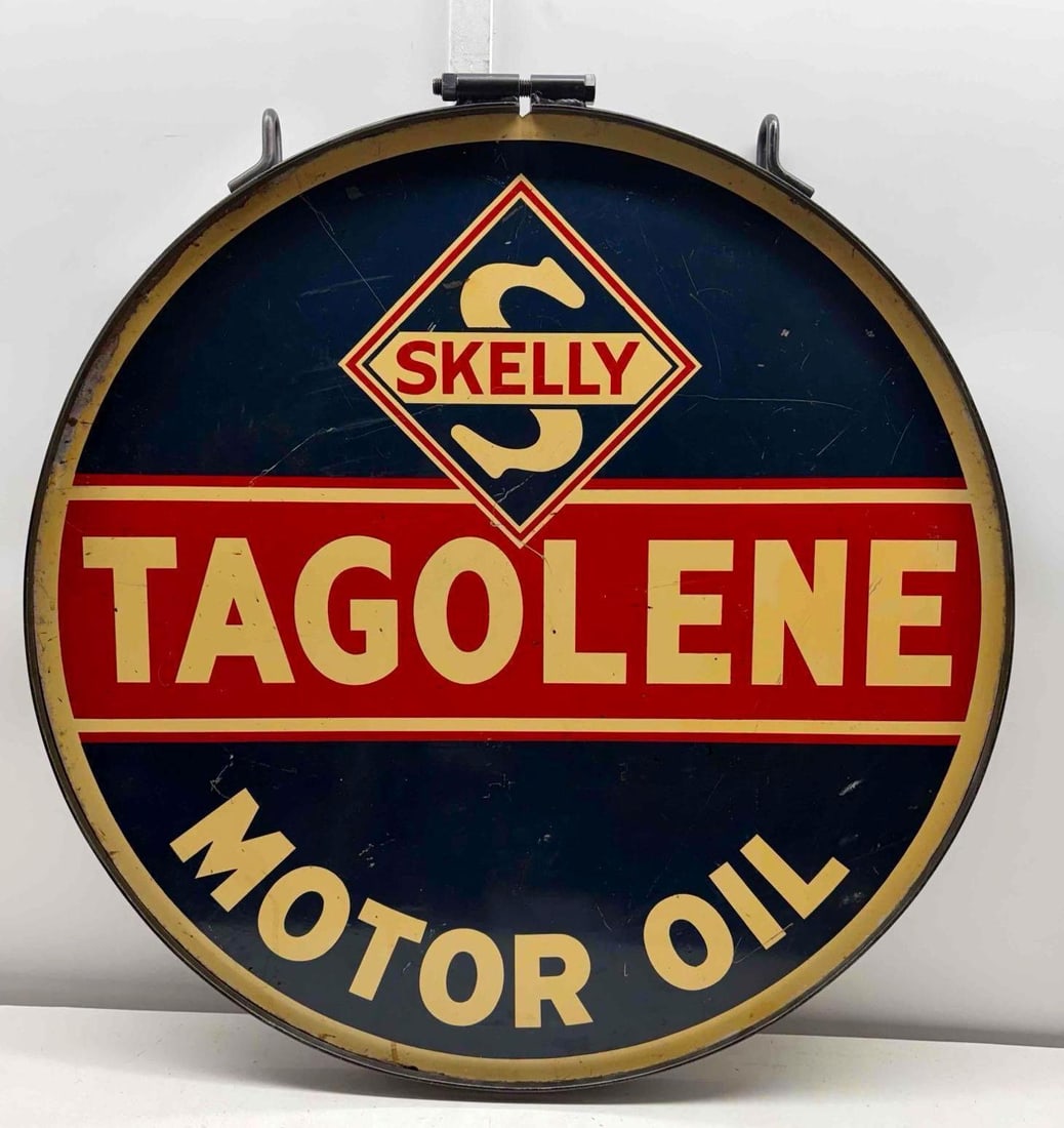 30" Skelly Tagolene Motor Oil Sign w/ Hanging Ring: Skelly Tagolene Motor Oil double sided painted metal sign. Presents with high-quality hanging ring, nice color and light wear. Measures 30".