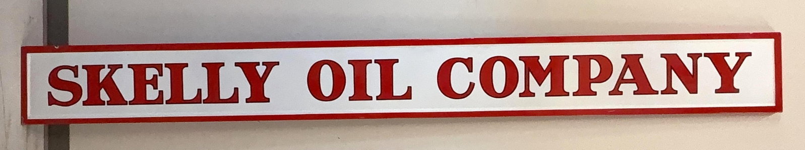 Skelly Oil Company Porcelain Sign: Skelly Oil Company single sided self-framing "cookie cutter" style porcelain sign. This filling station bay sign dates to the 1930's and presents with nice color and a few chips. Measures 12x114.