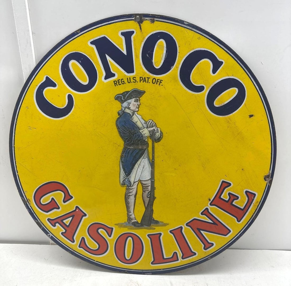 1920" Conoco Minuteman Porcelain Sign: Conoco Minuteman double sided porcelain sign.? Dates to the 1920's and features detailed iconic Minuteman image.? Display side presents with nice color and some scratches/wear.? Reverse presents with 